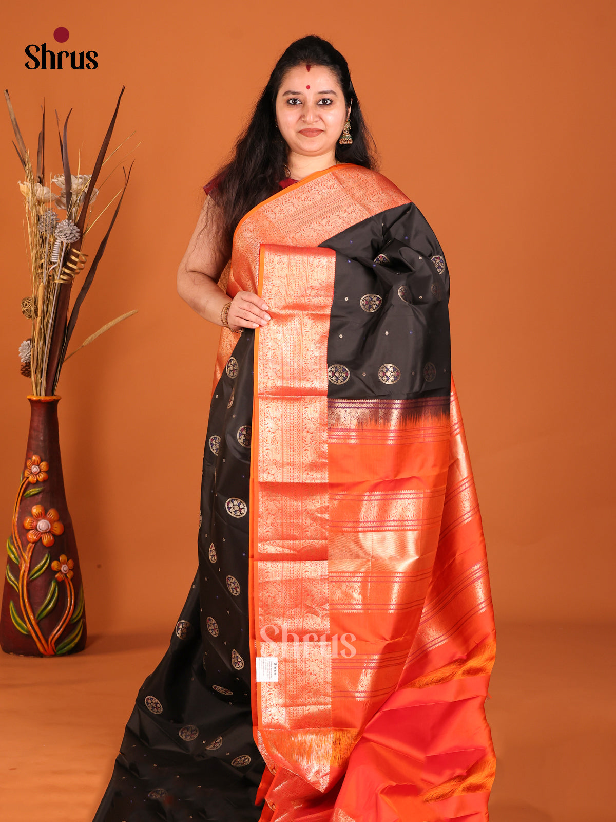 Black and orange Kanchipuram Butta design Saree