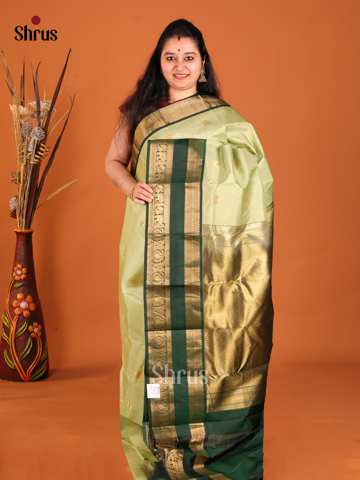 Cream green and mottle green Kanchipuram Butta design Saree