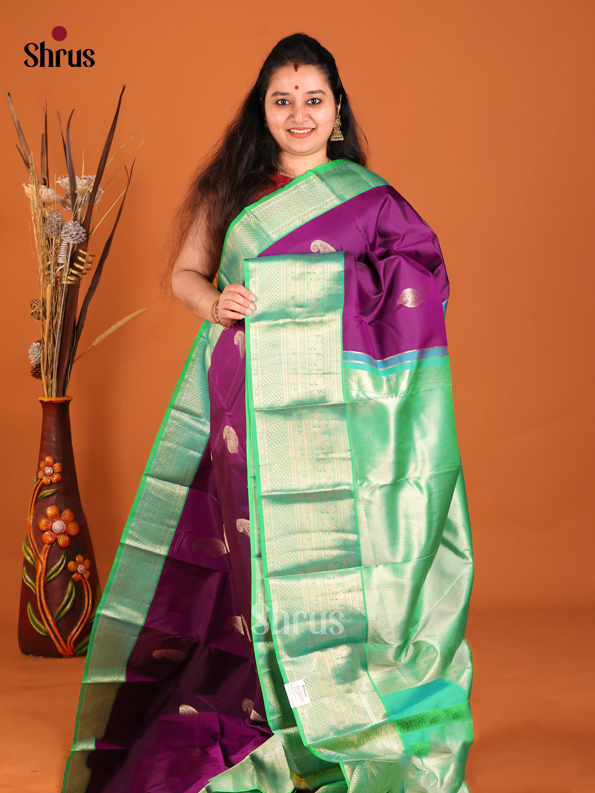 Purple & Green Kanchipuram Butta design Saree with paisley motifs