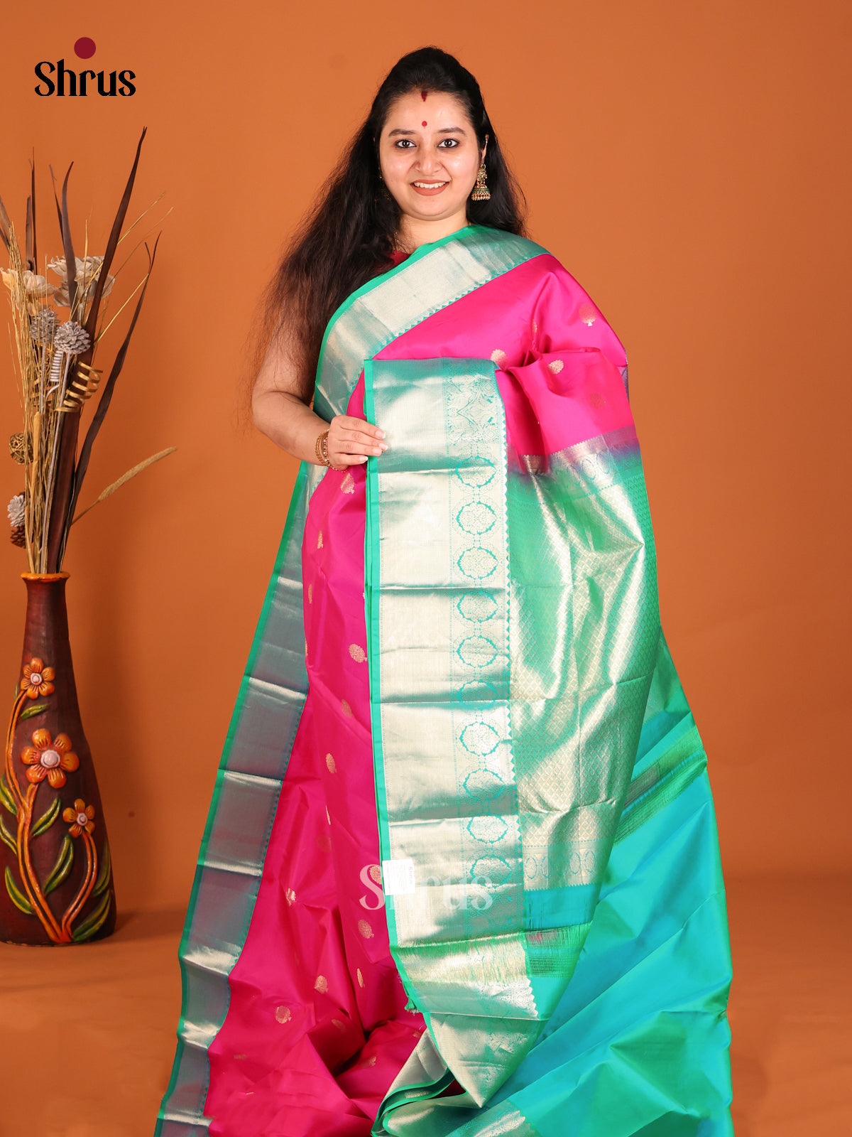 Pink & Green Kanchipuram Butta design Saree with rich elephant buttas border