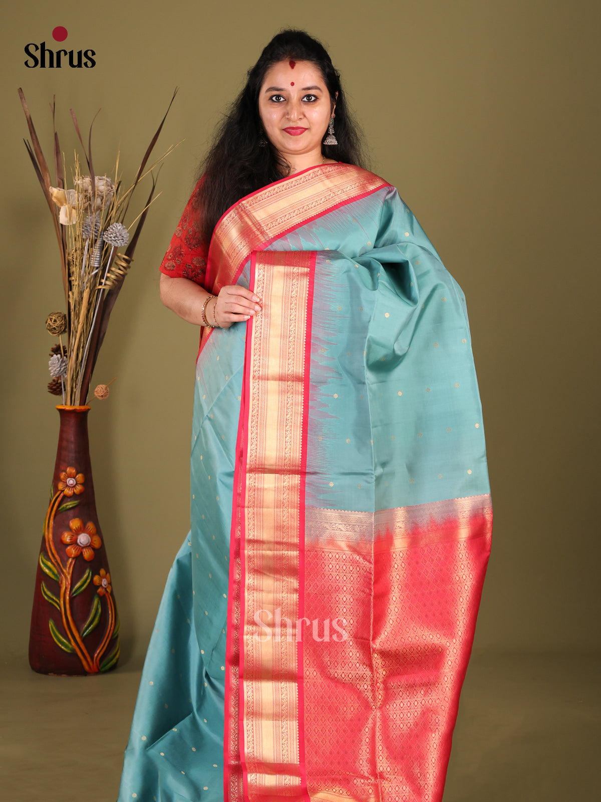 Sheeny Pastel Blue Soft Silk Saree with Zari Buttas & Orangish Pink rich zari border