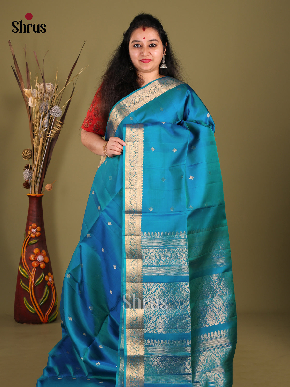 Peacock Blue Soft Silk Saree with floral vines zari border - Shop on Shrus.com