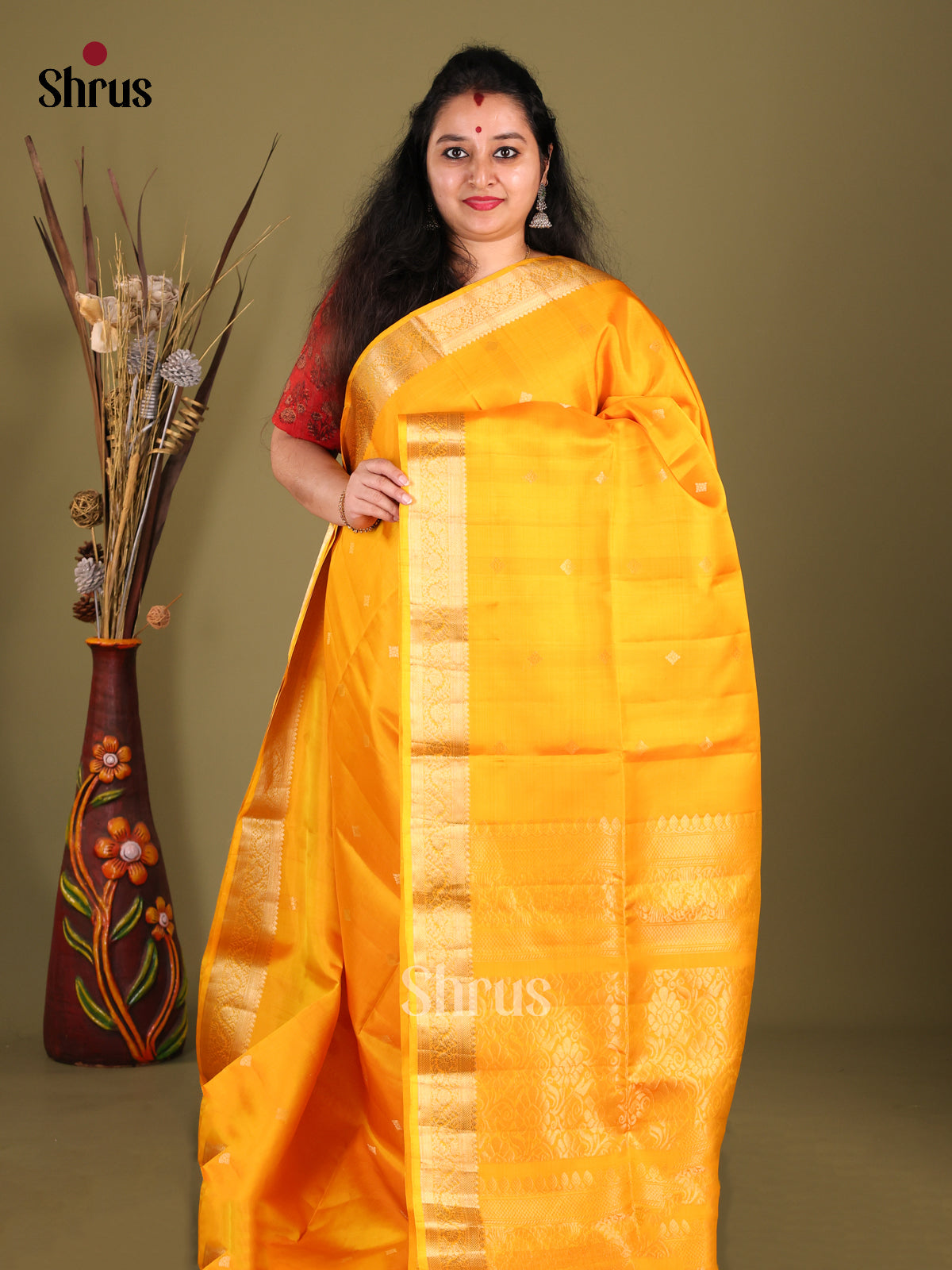 Lustrous Yellow Soft Silk Saree with zari buttas & Brocade Border