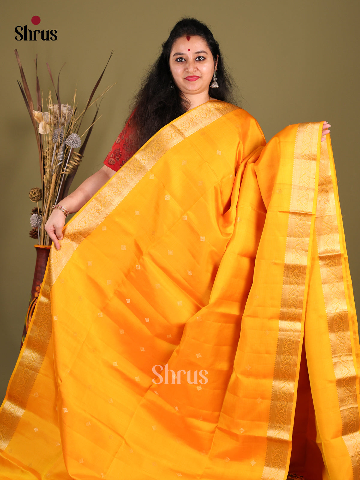 Lustrous Yellow Soft Silk Saree with zari buttas & Brocade Border