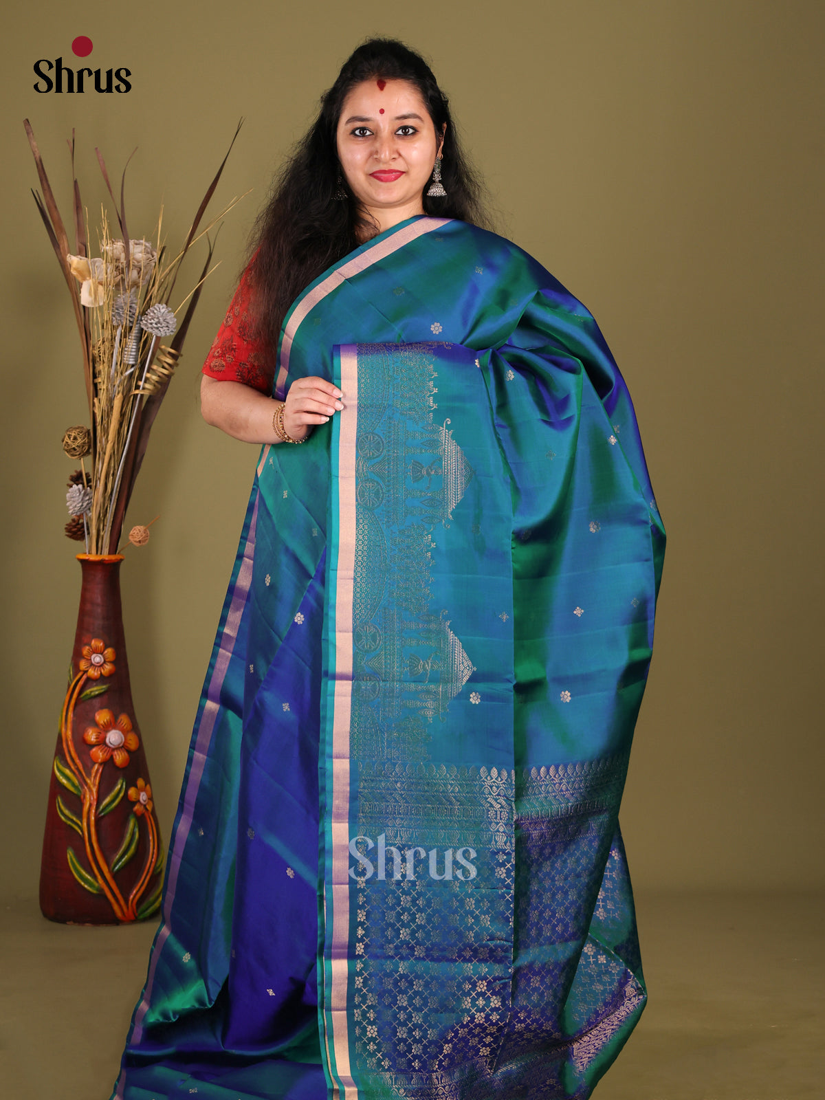 Peacock Blue Single Tone Soft Silk Saree gleams with zari buttas - Shop on Shrus.com