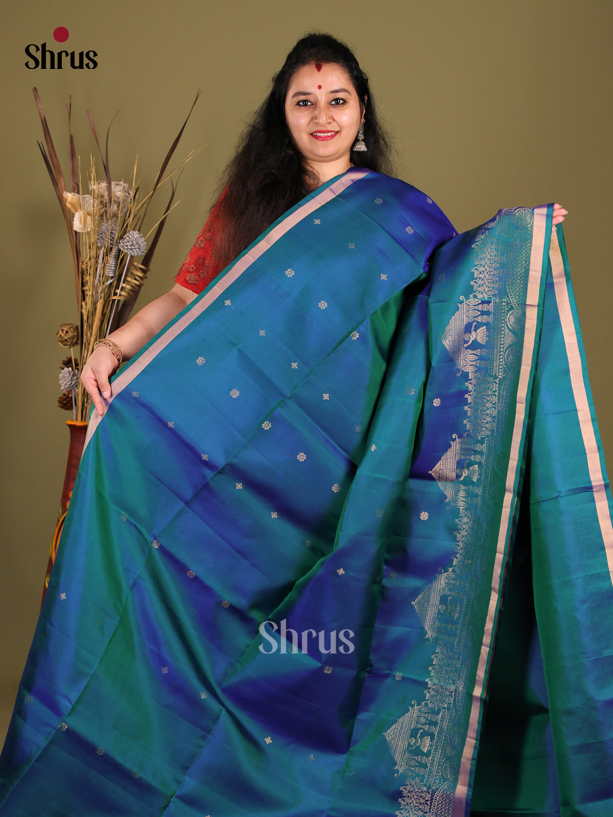 Peacock Blue Single Tone Soft Silk Saree gleams with zari buttas - Shop on Shrus.com