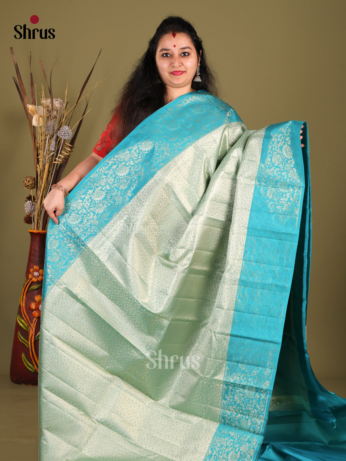 Exquisite Pastel Green Kanjivaram Silk Saree with Floral Brocade & Blue Zari Border -1