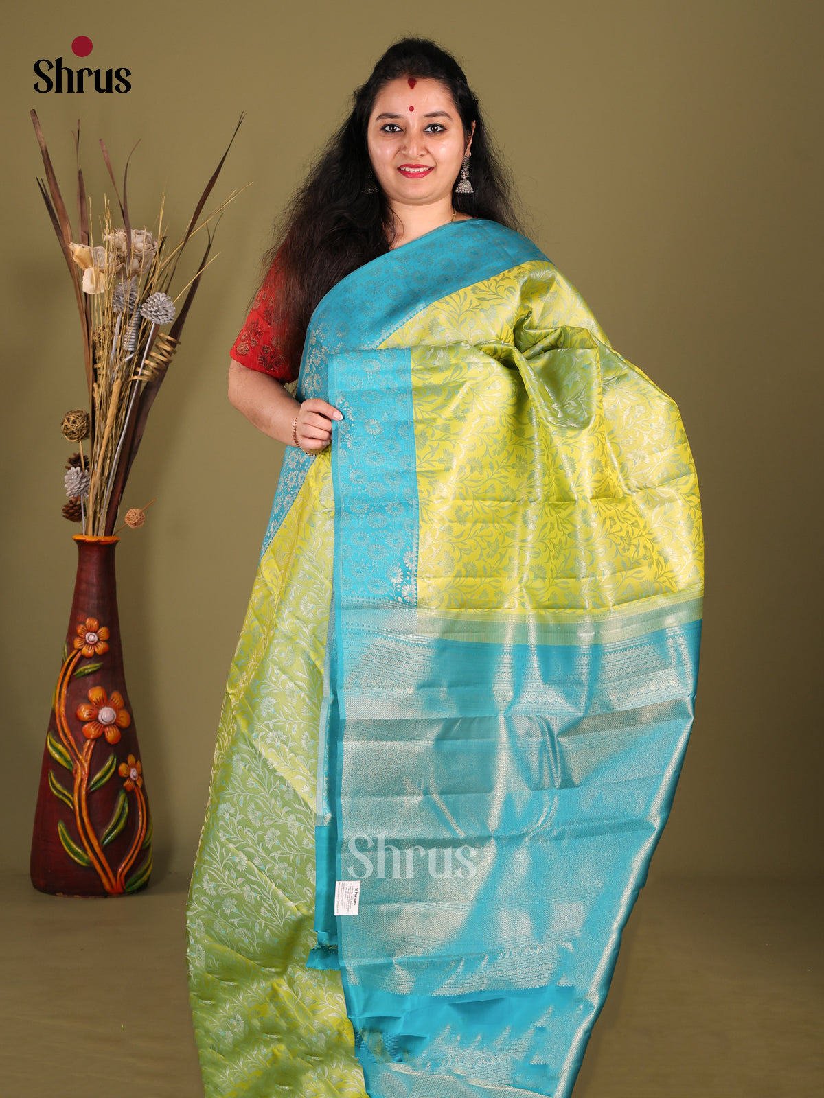 Classic Light Green Kanjivaram silk Saree with Woven Floral brocade Body & Blue Border