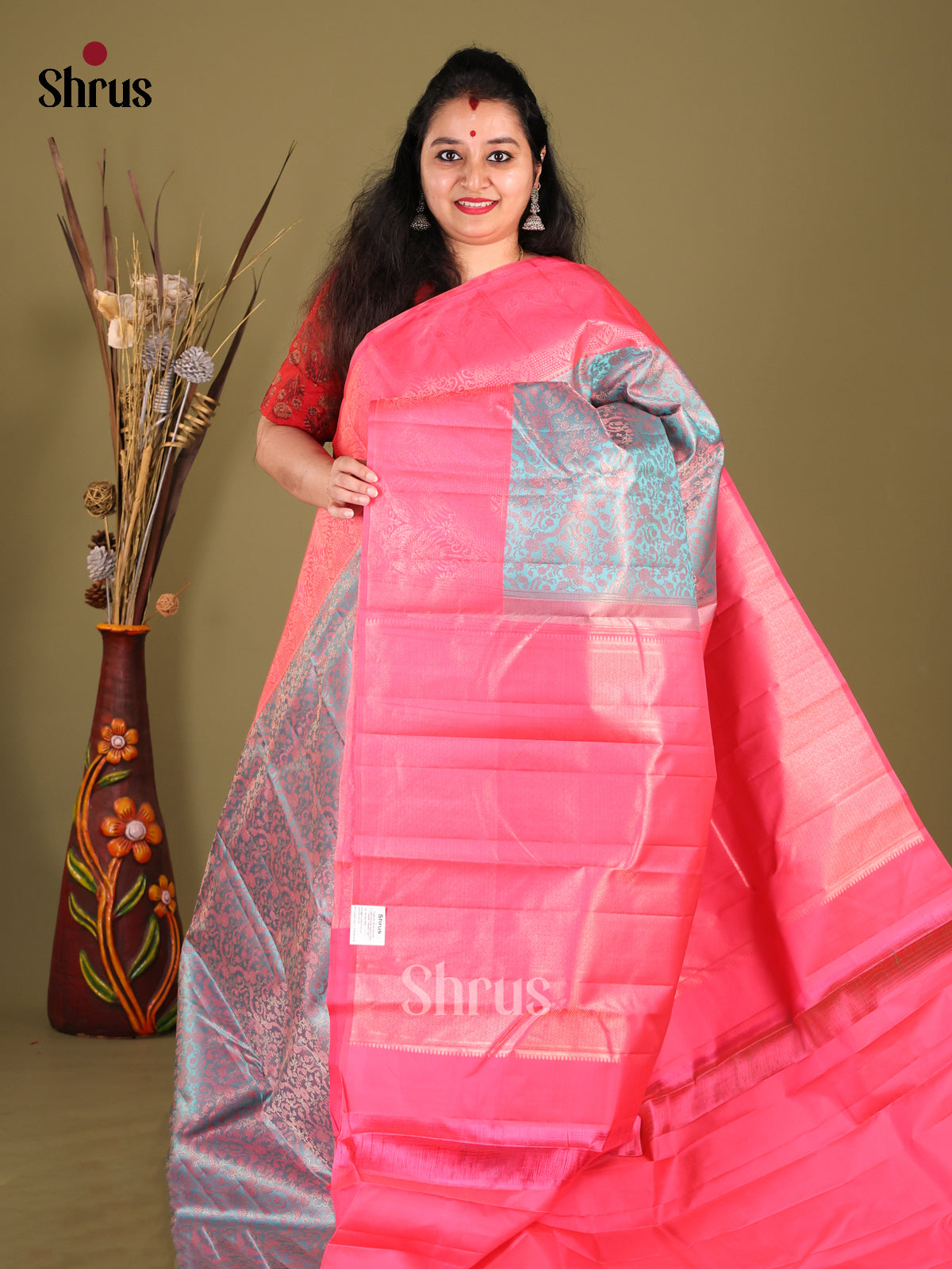 Exquisite Blue Kanjivaram silk Saree with floral nestling brocade & Pink Border
