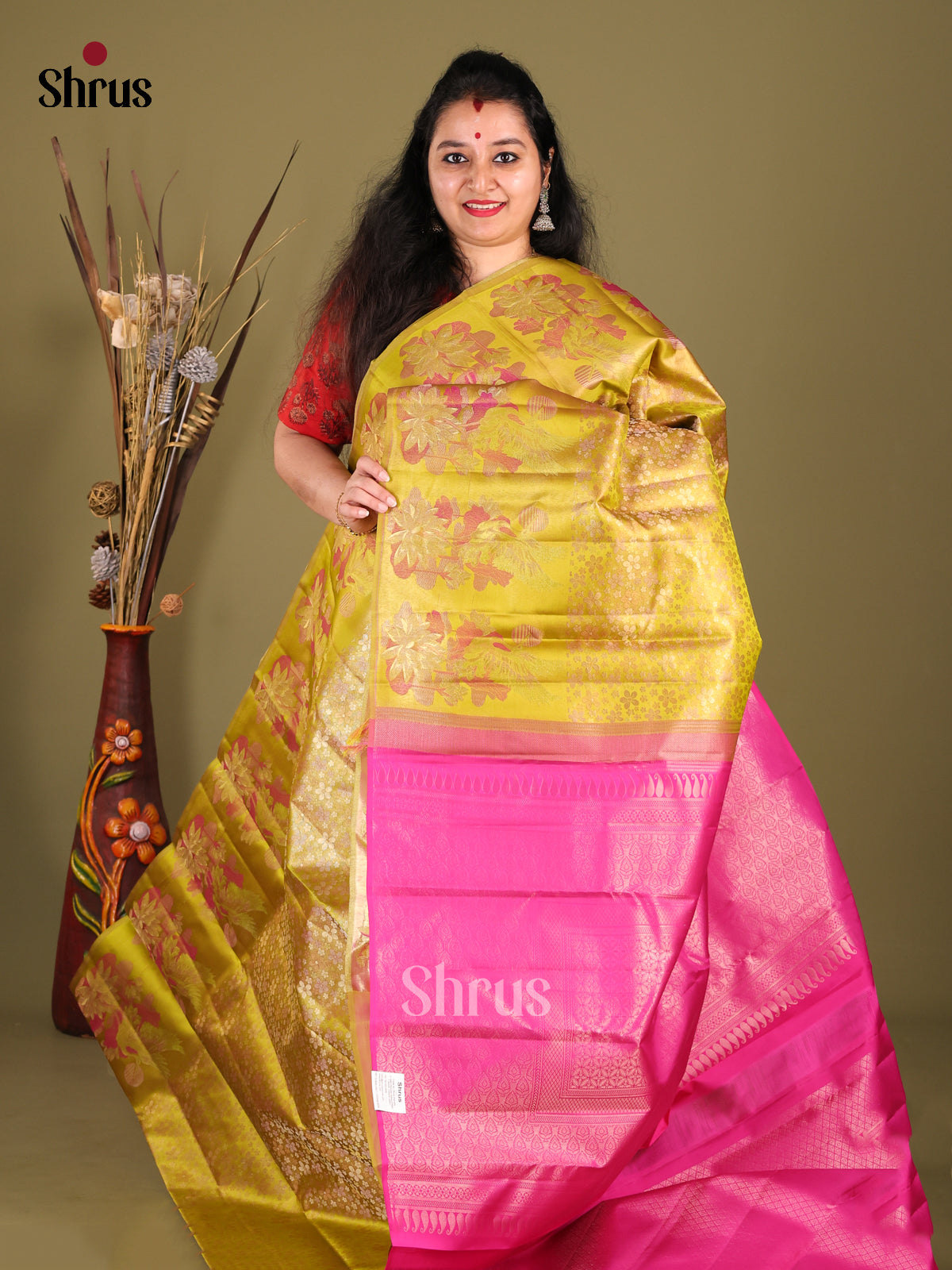Gorgeous Mustardy Green Kanjivaram silk Saree with floral nestling brocade & Pink Pallu