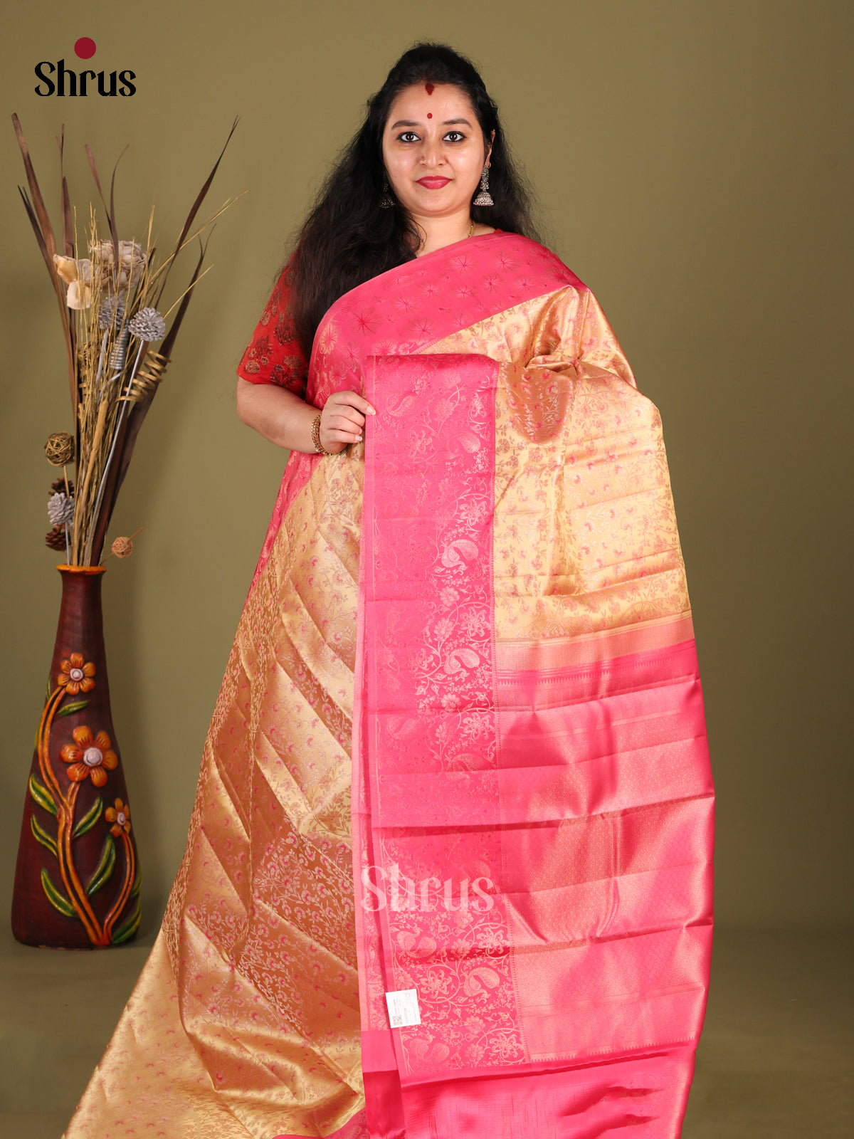 Elegant Peach Kanjivaram Saree with floral nestling brocade & Pink Border