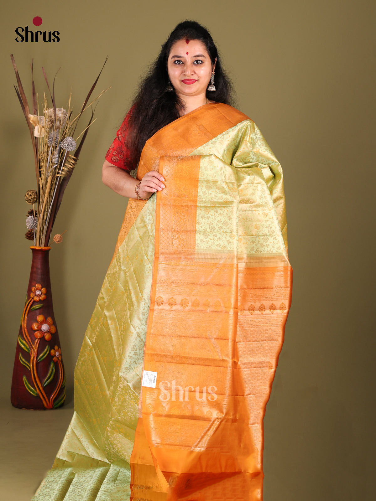 Light Green & Orange Kanchipuram silk Saree with zari floral nestling brocade