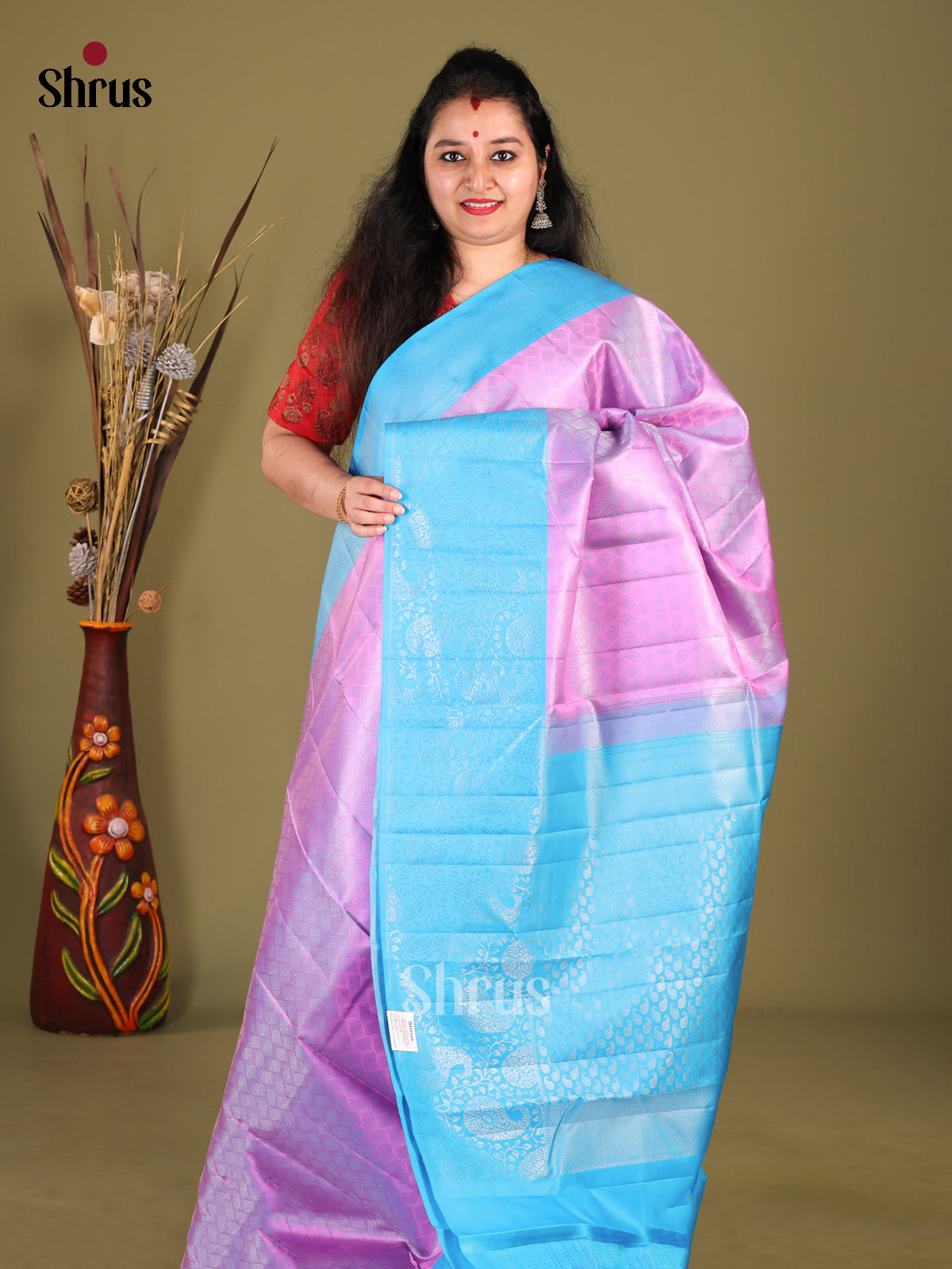 Charming Purple Kanjivaram Silk Saree with floral nestling brocade & Blue Border