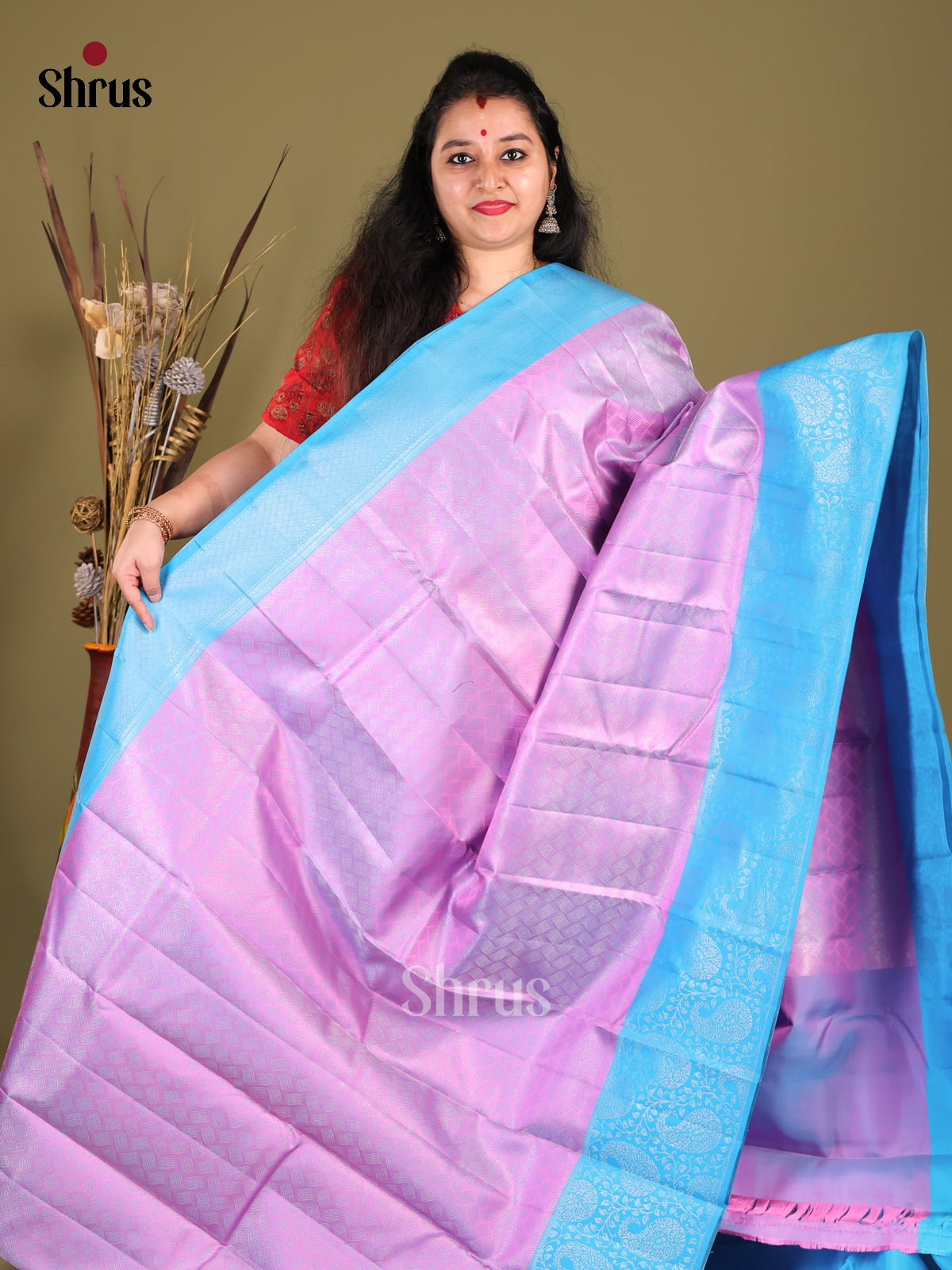 Charming Purple Kanjivaram Silk Saree with floral nestling brocade & Blue Border