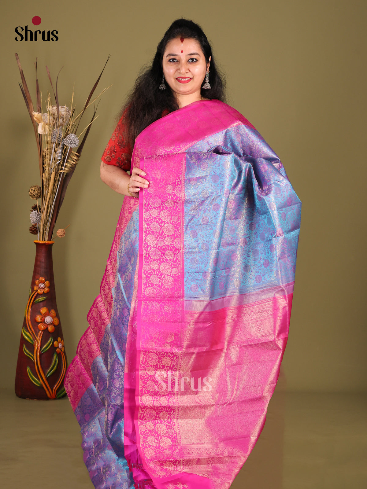 Vibrant Blue Kanjivaram silk Saree with floral nestling brocade & Pink Border