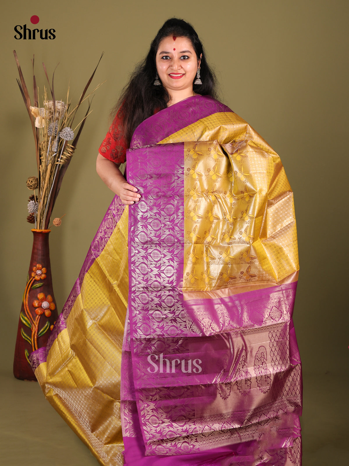 Glorious Mustard Kanjivaram silk Saree with Nestling brocade & Purple Border