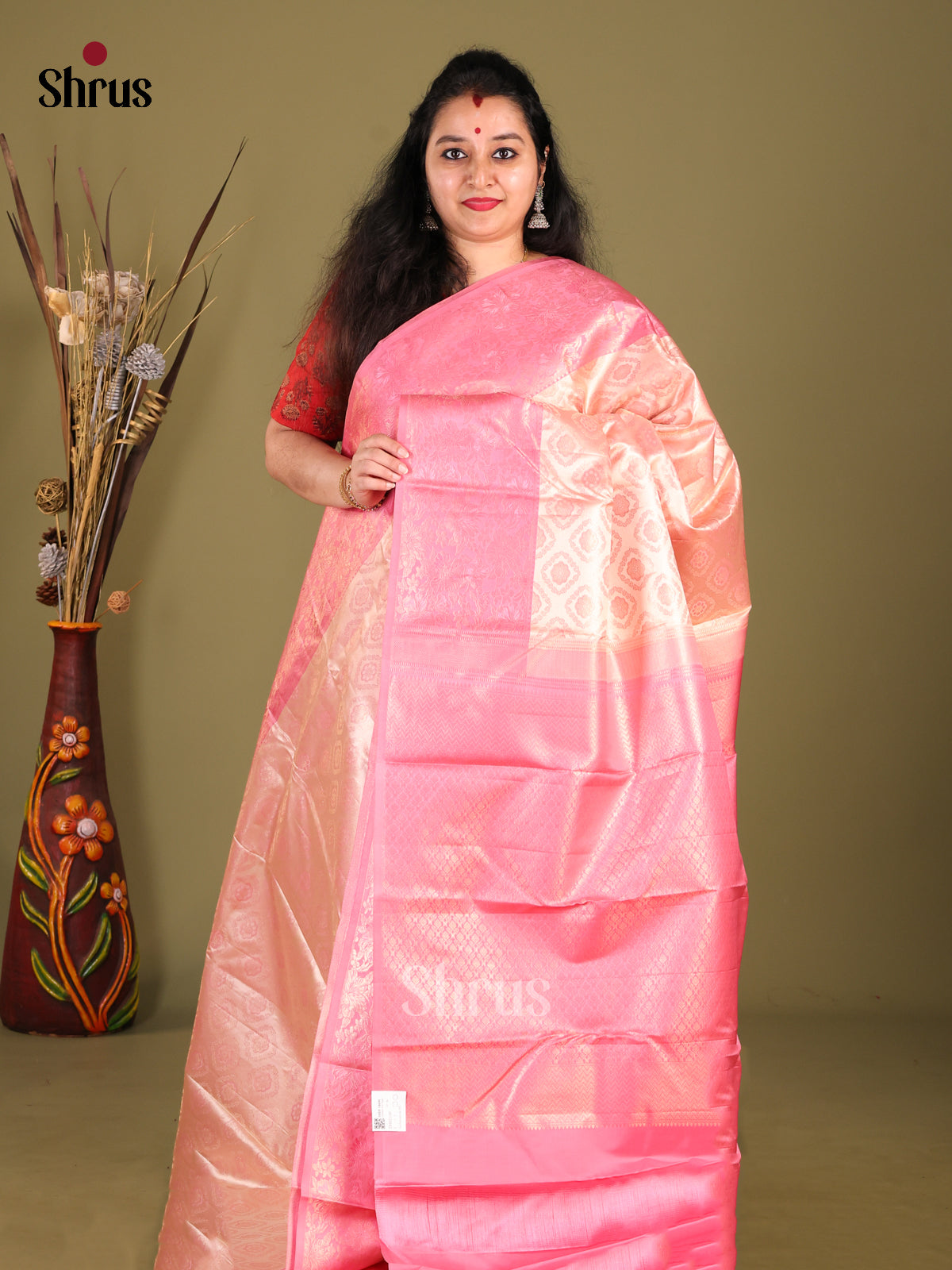 Elegant Peach Kanchipuram silk Saree with Intricate Brocade & Pink border