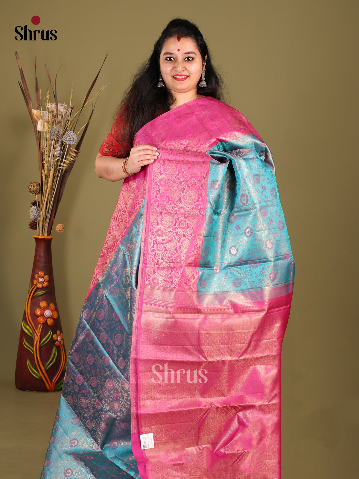 Serene Blue Kanjivaram Saree with floral nestling brocade & Pink Border
