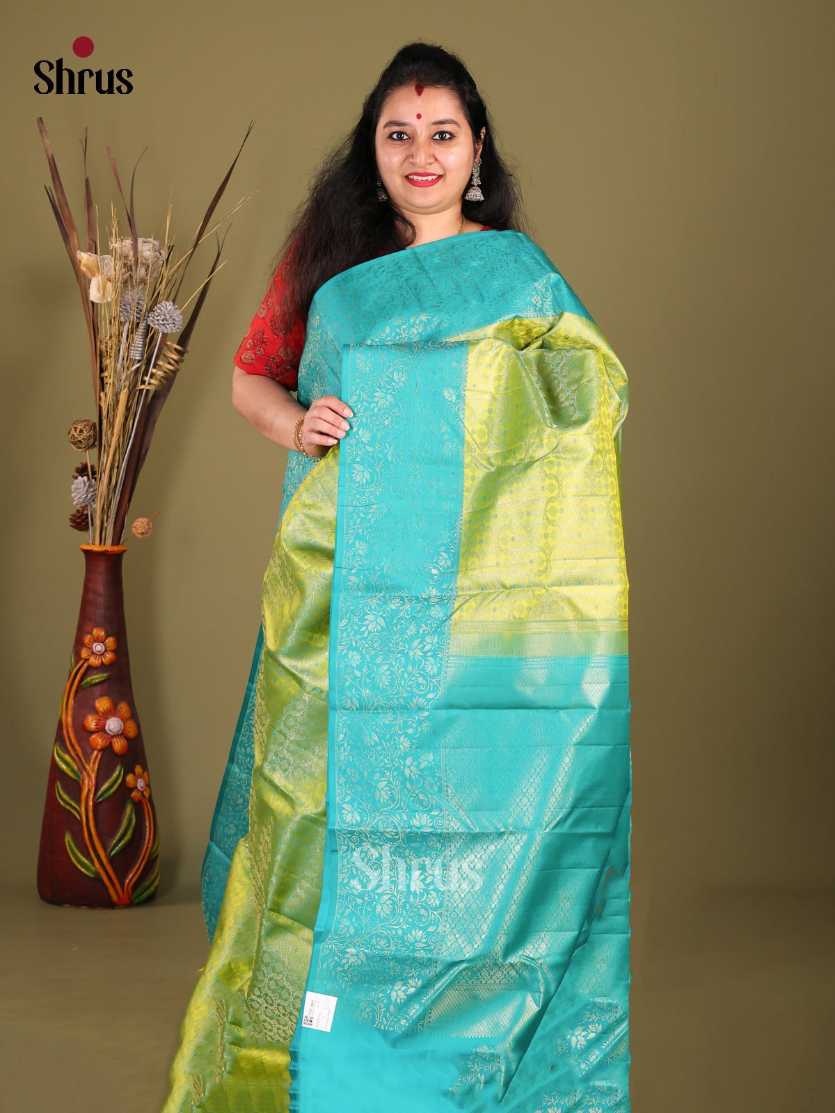 Light Green & Blue Kanchipuram silk Saree gleams with zari brocade