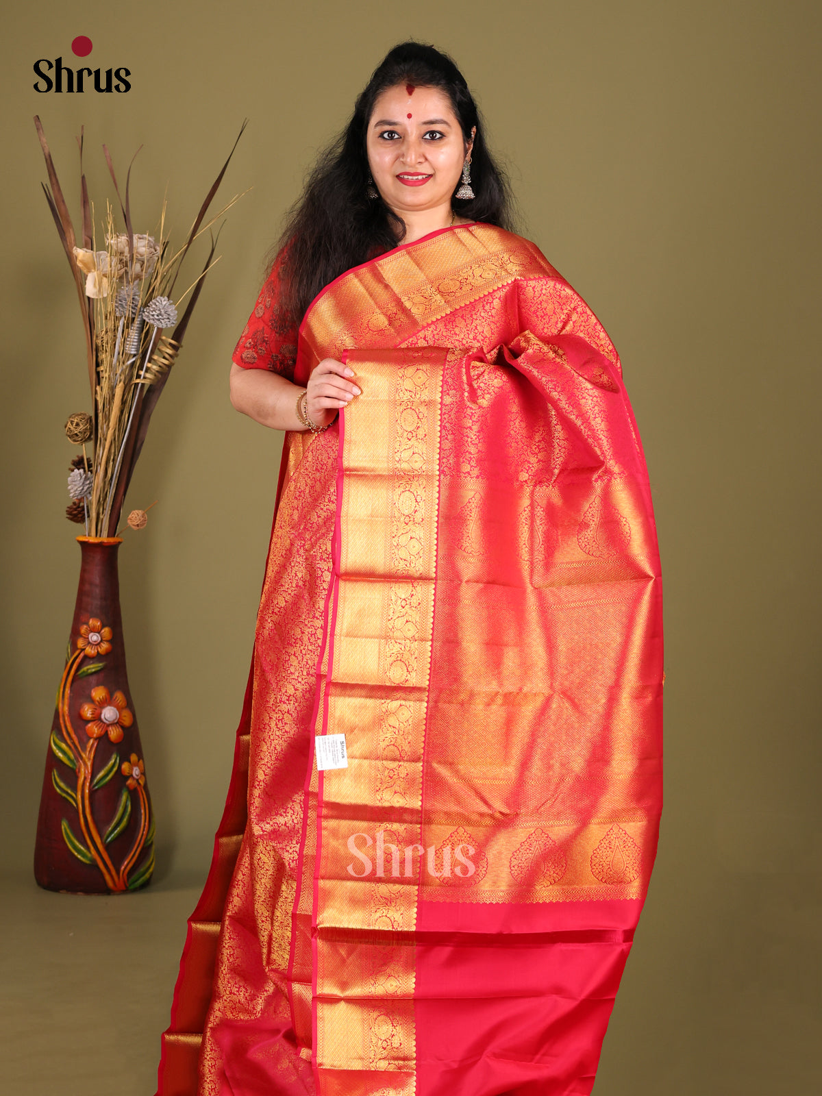 Rich Orangish Pink Kanchipuram silk Saree with floral nestling brocade & Zari Border