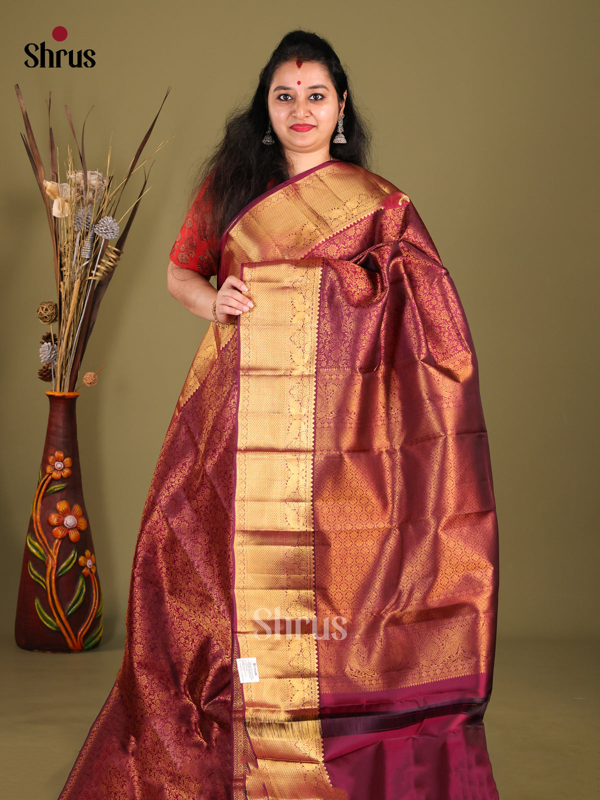 Elegant Maroon Kanjivaram Saree with zari woven floral nestling brocade