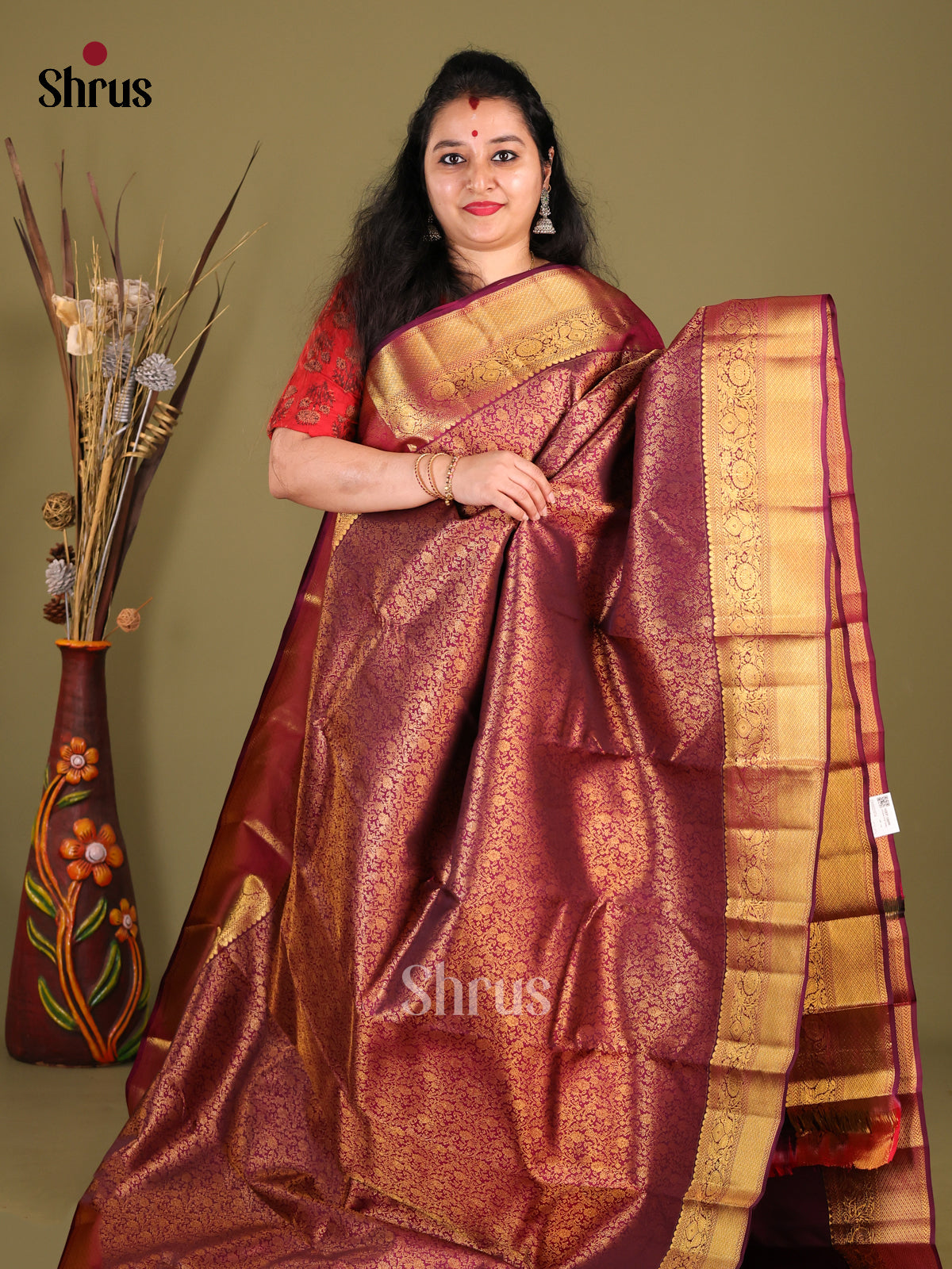 Classy Maroon Kanchipuram Saree with golden floral nestling brocade Design -1