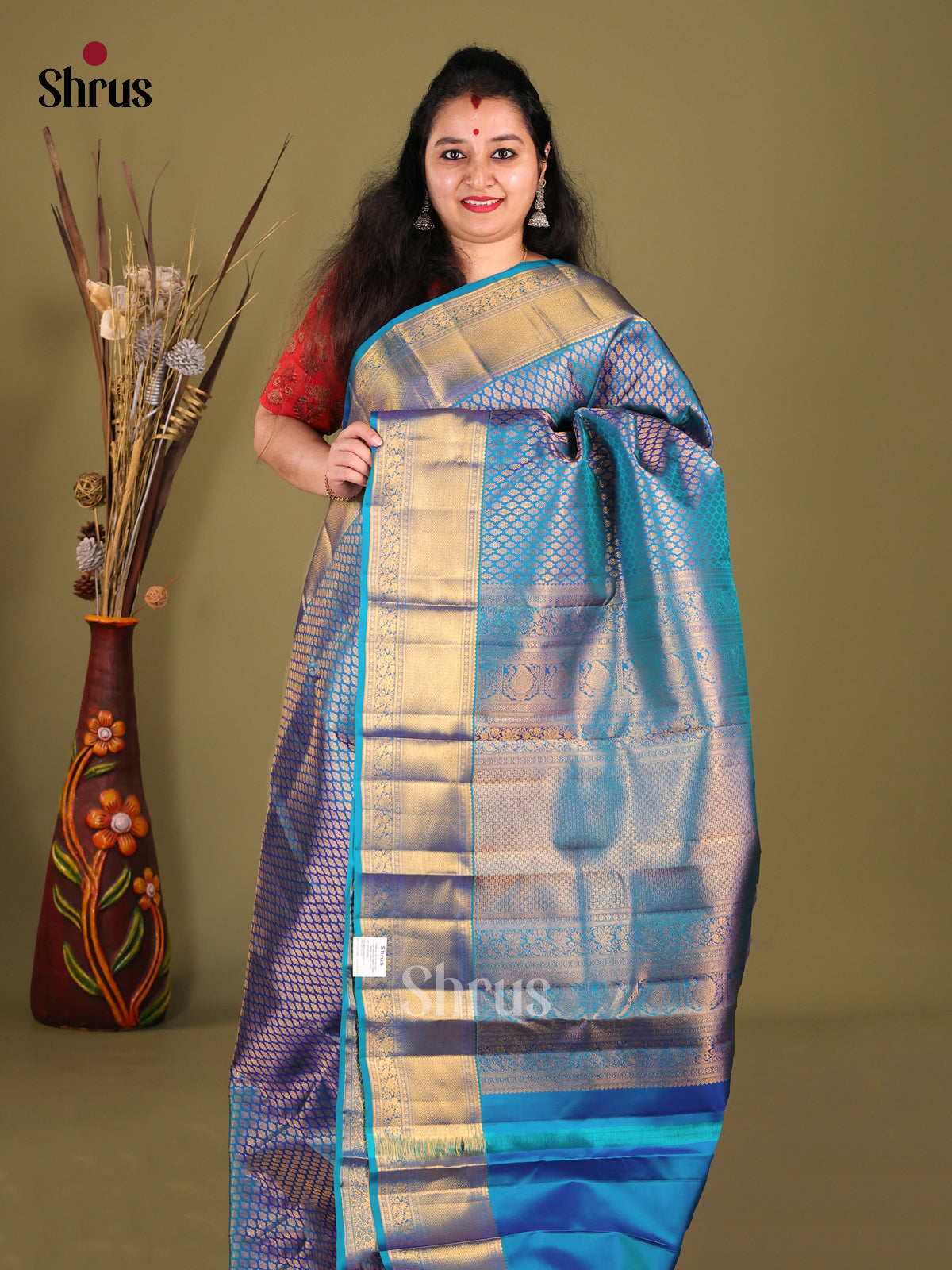 Vibrant Blue Kanchipuram Saree with rich Golden BRocade Body & Zari Woven Border