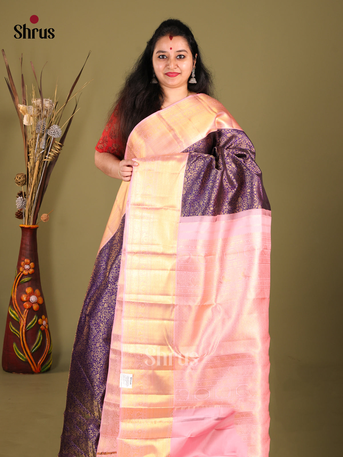Dazzling Violet Kanjivaram Saree with gold floral nestling brocade & Pink Zari Border