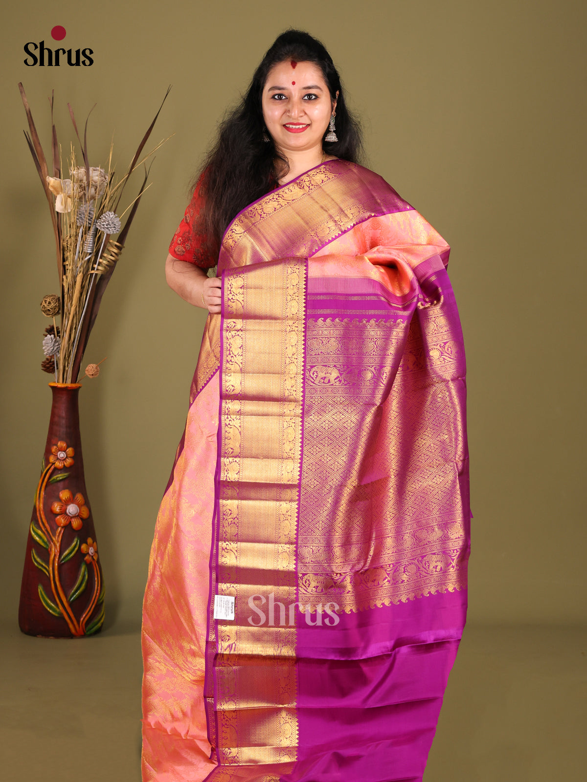 Exquisite Peach Kanjivaram Saree with gold floral brocade & Majenta Zari Woven Border
