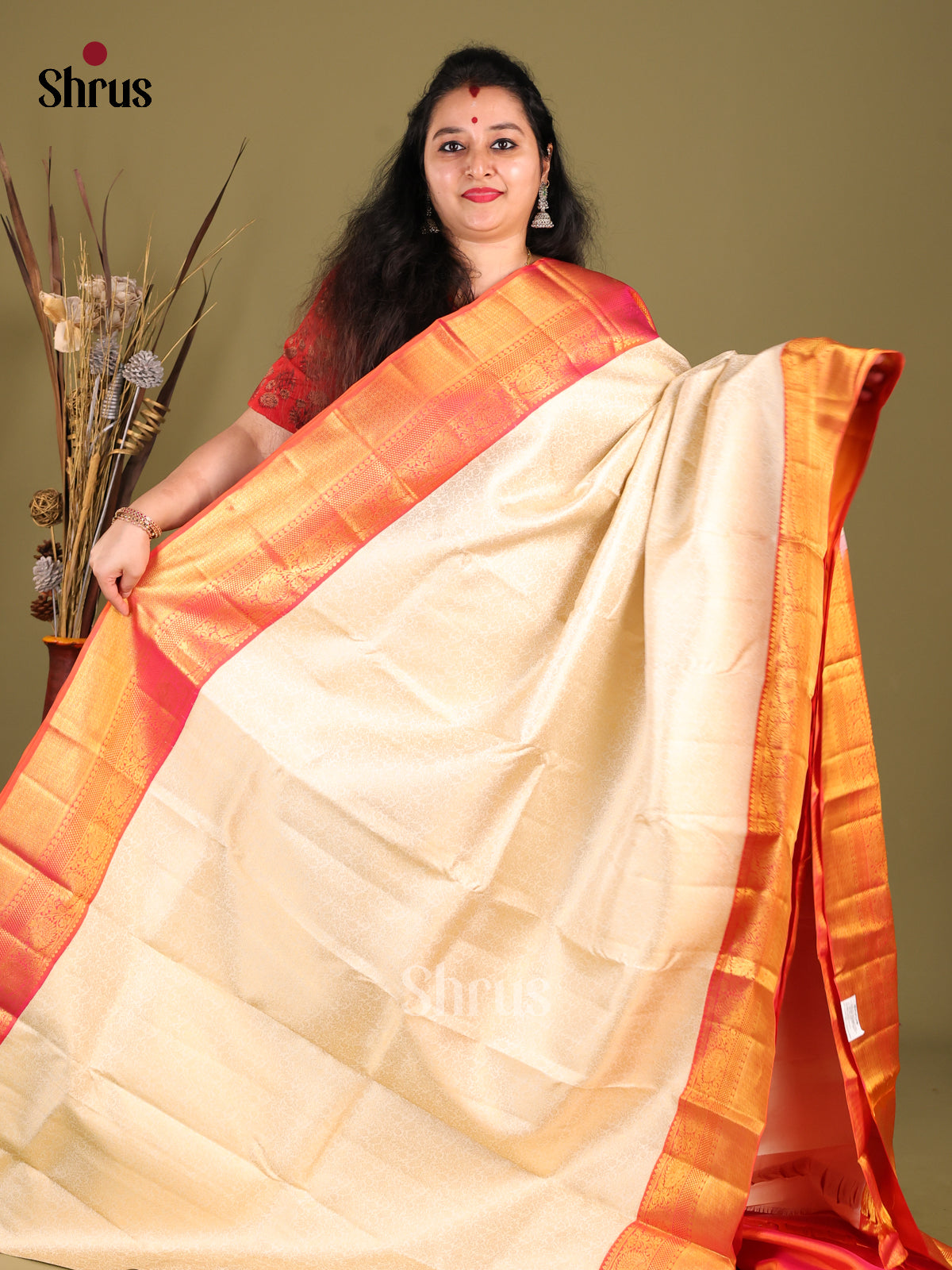 Timeless Cream Kanchipuram silk Saree with Floral Nestling Brocade & Orange zari border -1