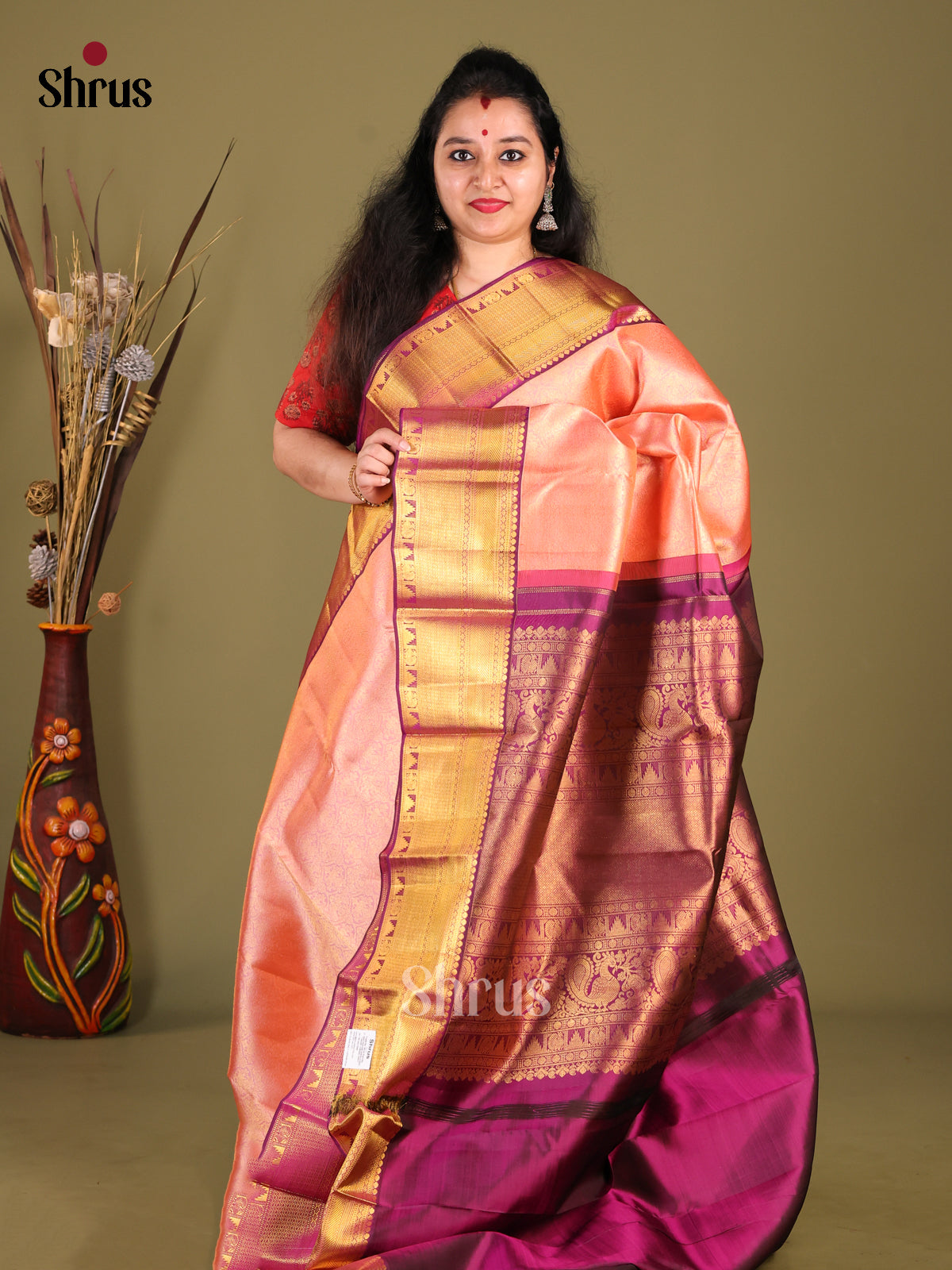 Chic Peach Kanchipuram Saree with Brocade border & Beautifully Woven Purple Pallu