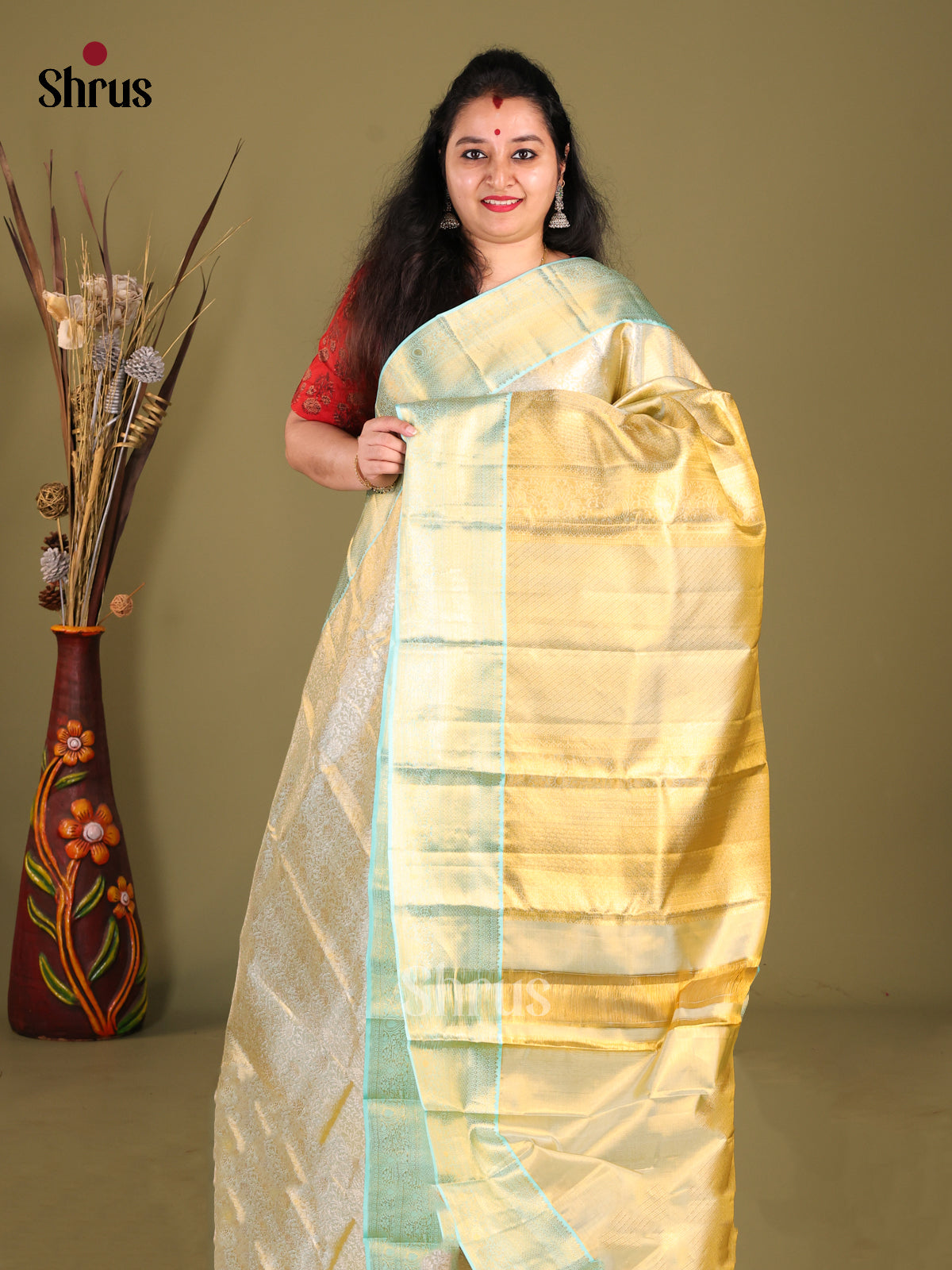 Elegant Cream Kanchipuram Saree with zari brocade & Teal Zari Border 1