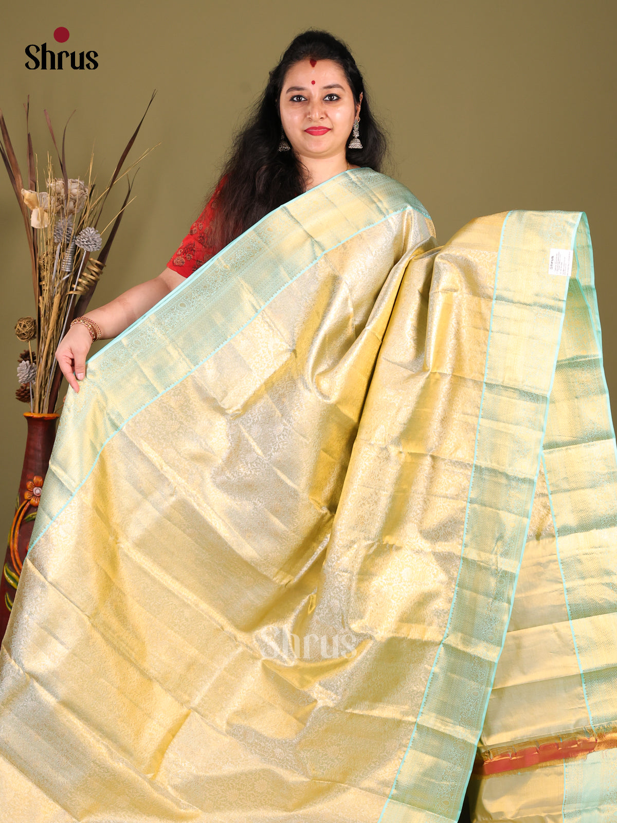 Elegant Cream Kanchipuram Saree with zari brocade & Teal Zari Border