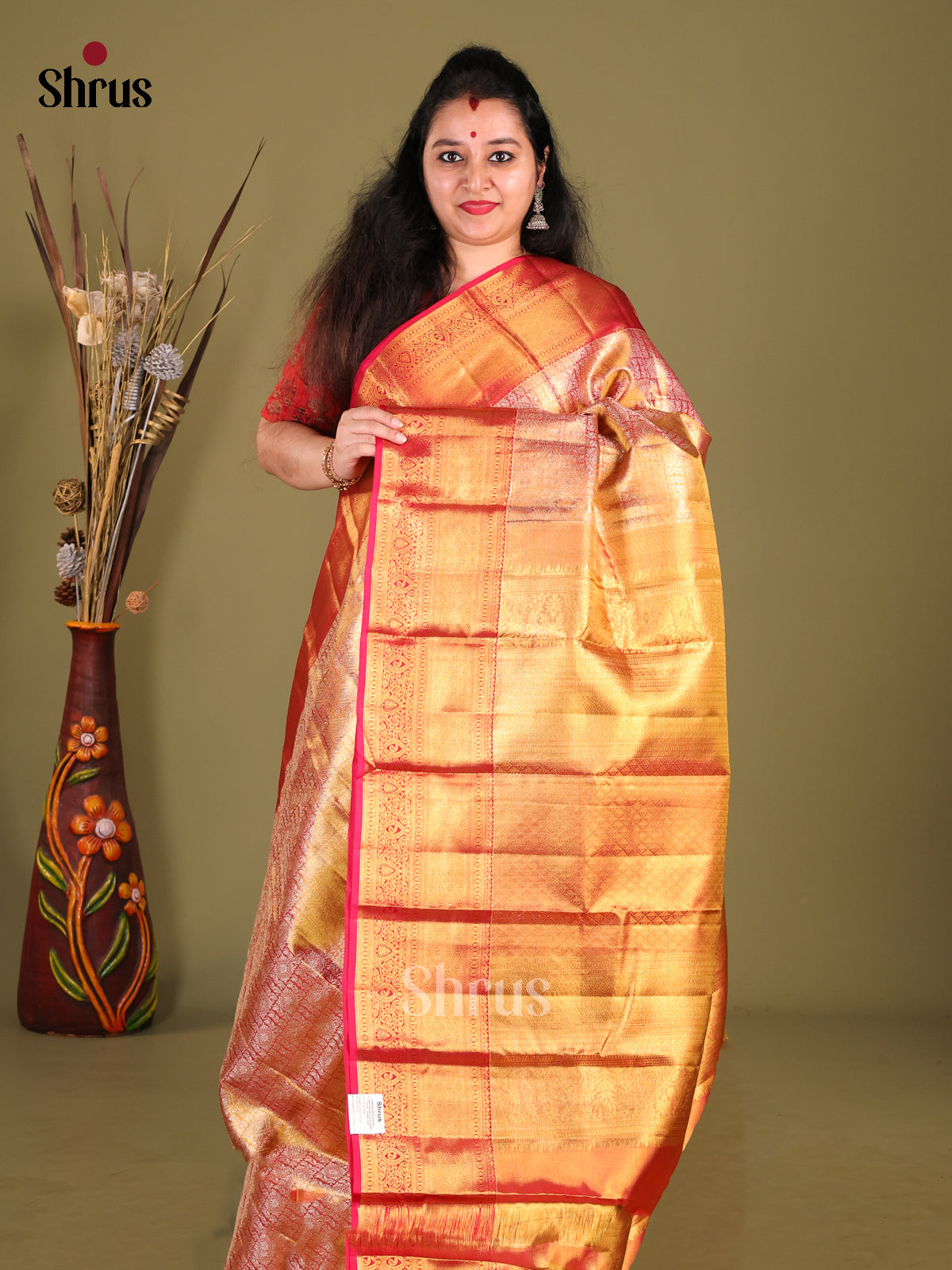 Dazzling Red Kanjivaram Saree with rich traditional zari border