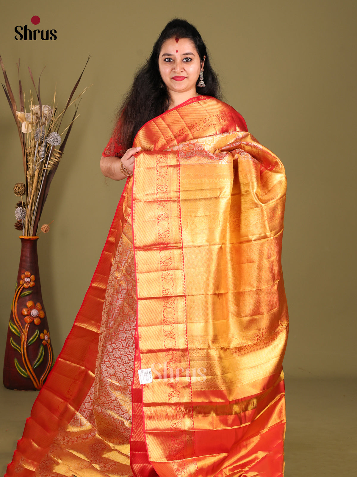 Glimmering Orange Kanchipuram silk Saree woven with rich Zari Brocade & self zari border