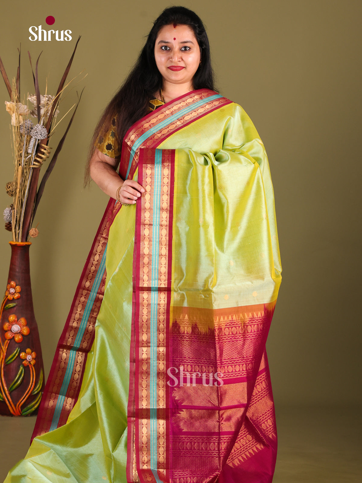 Lustrous Light Green Silk Cotton Saree With Maroon Korvai Rettaipet Border