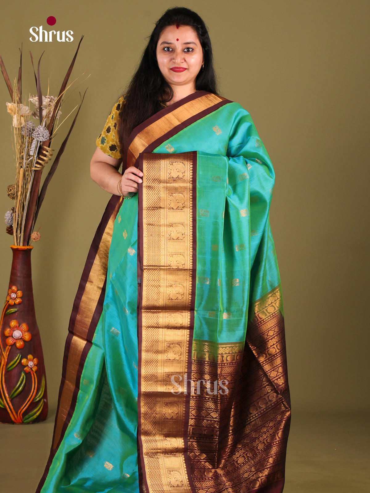 Serene Green Silk Cotton Saree with Zari Peacock Buttas & Korvai Border - Shop on Shrus.com