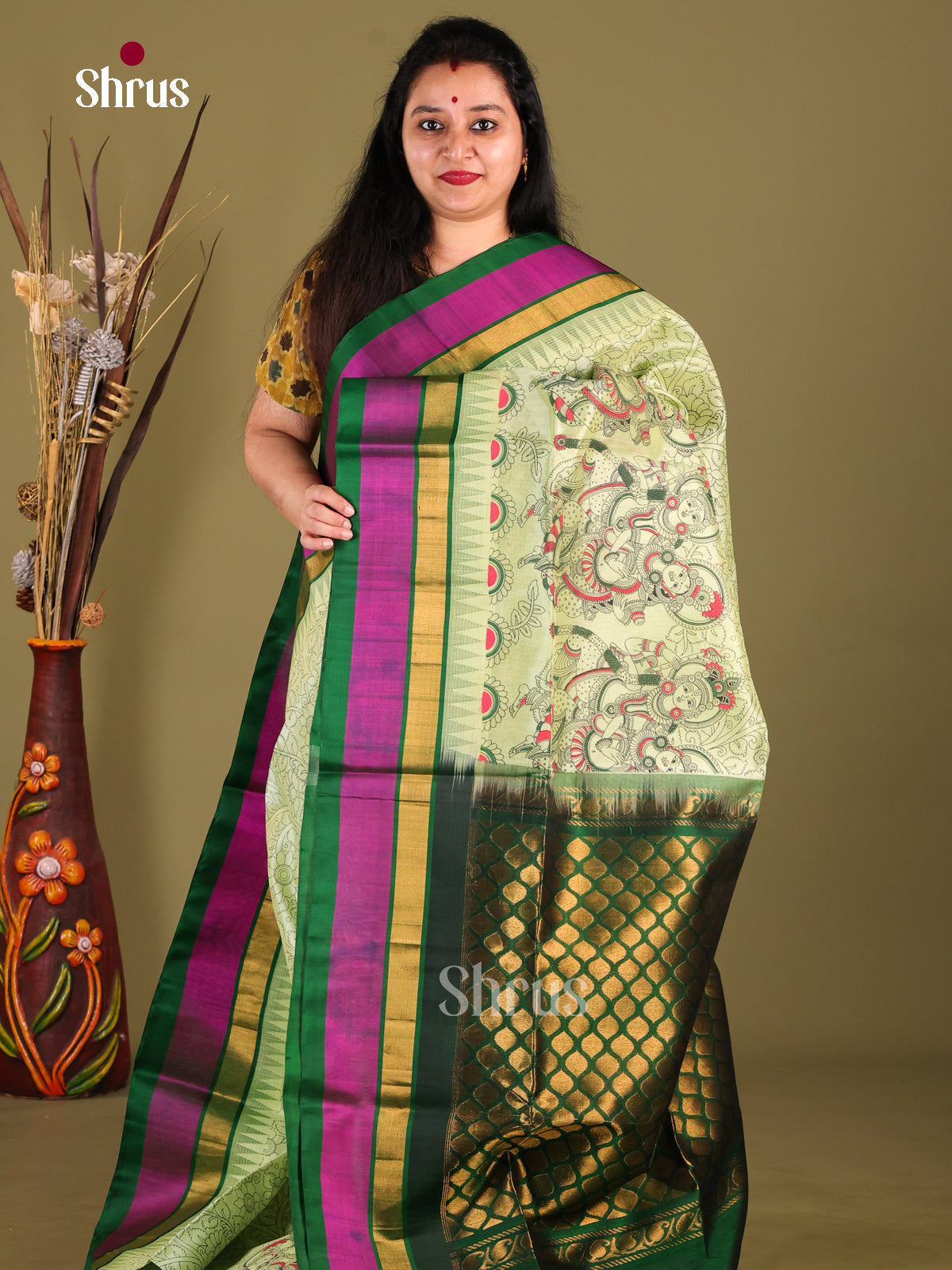 Classy Pista Green Silk Cotton Saree With Kalamkari Prints & Green Temple Border - Shop on Shrus.com