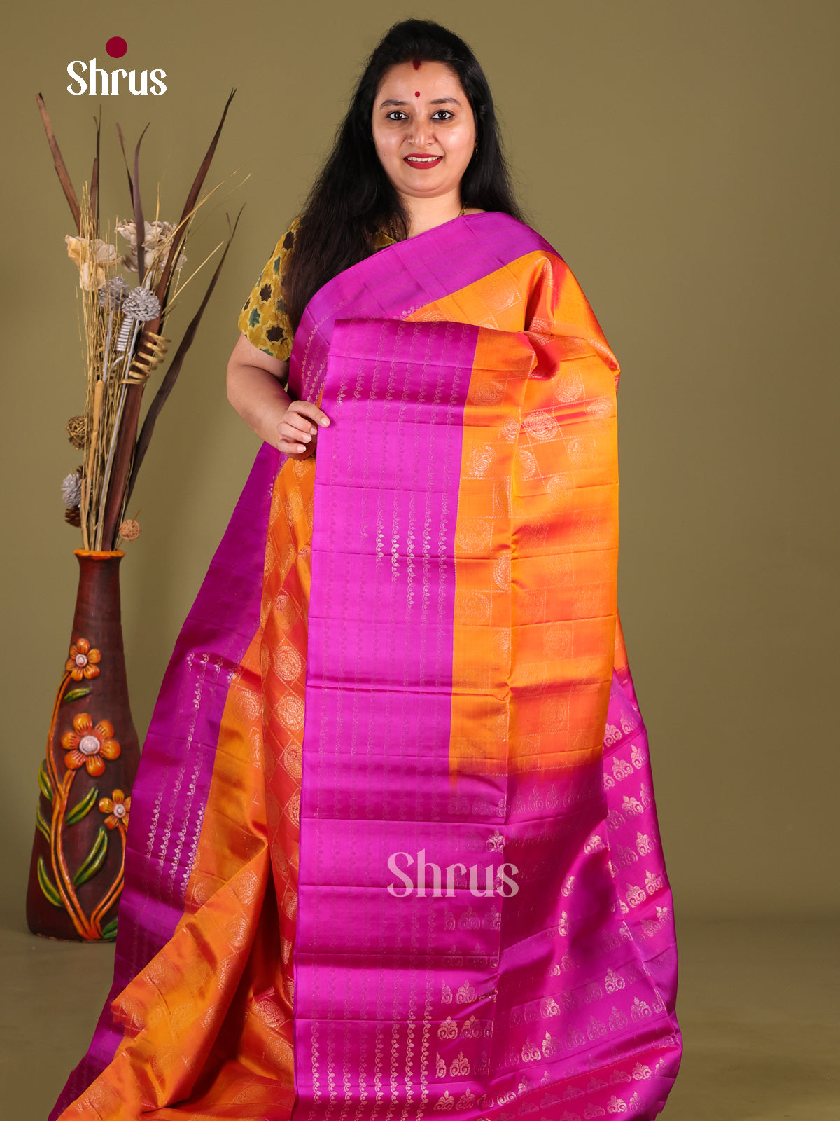 Enchanting Orange Soft Silk Saree with zari checks, floral buttas & Majenta Pallu
