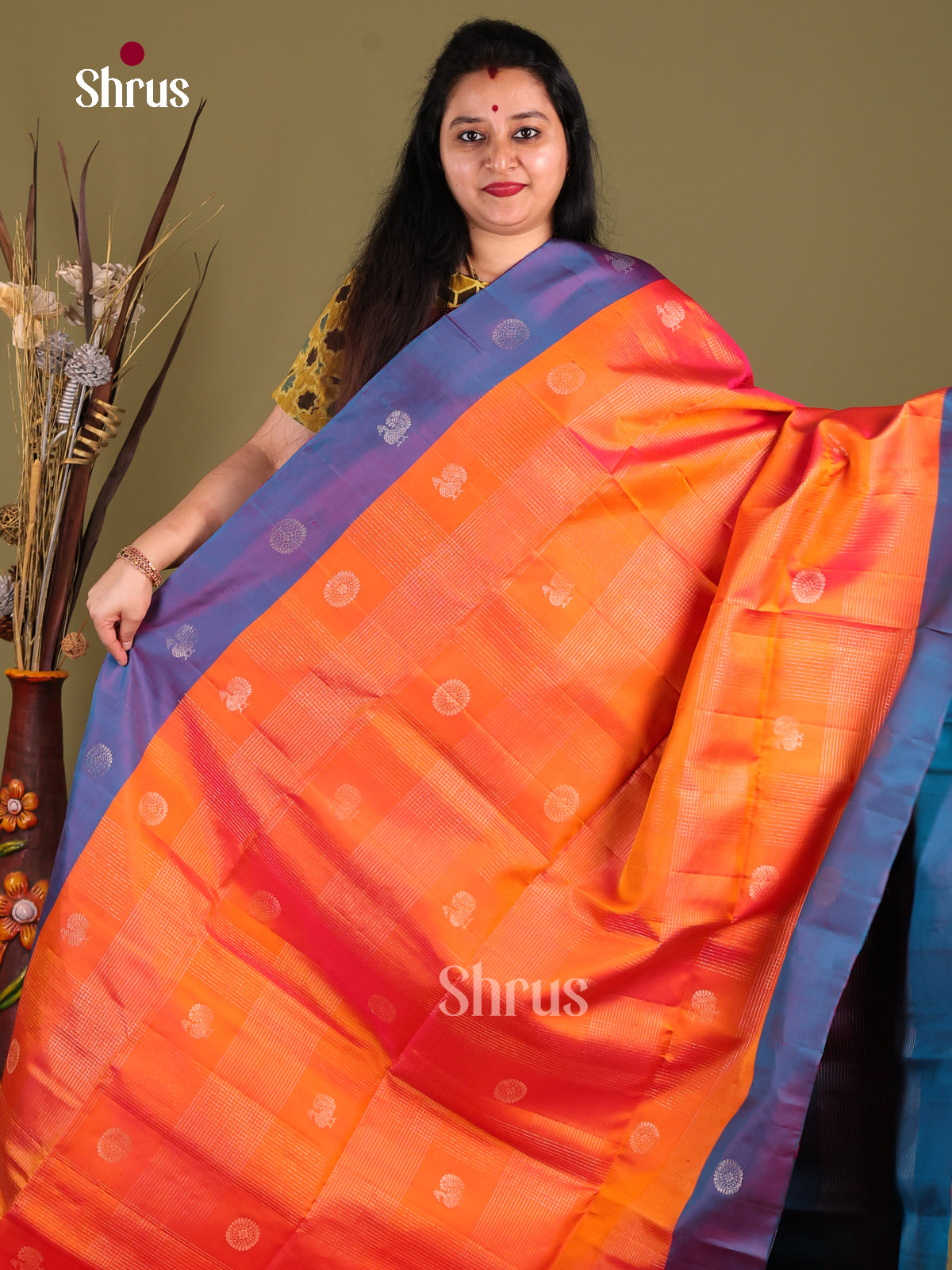 Radiant Orange Soft Silk Saree with peacock & floral buttas adorned With Brocade Pallu -1