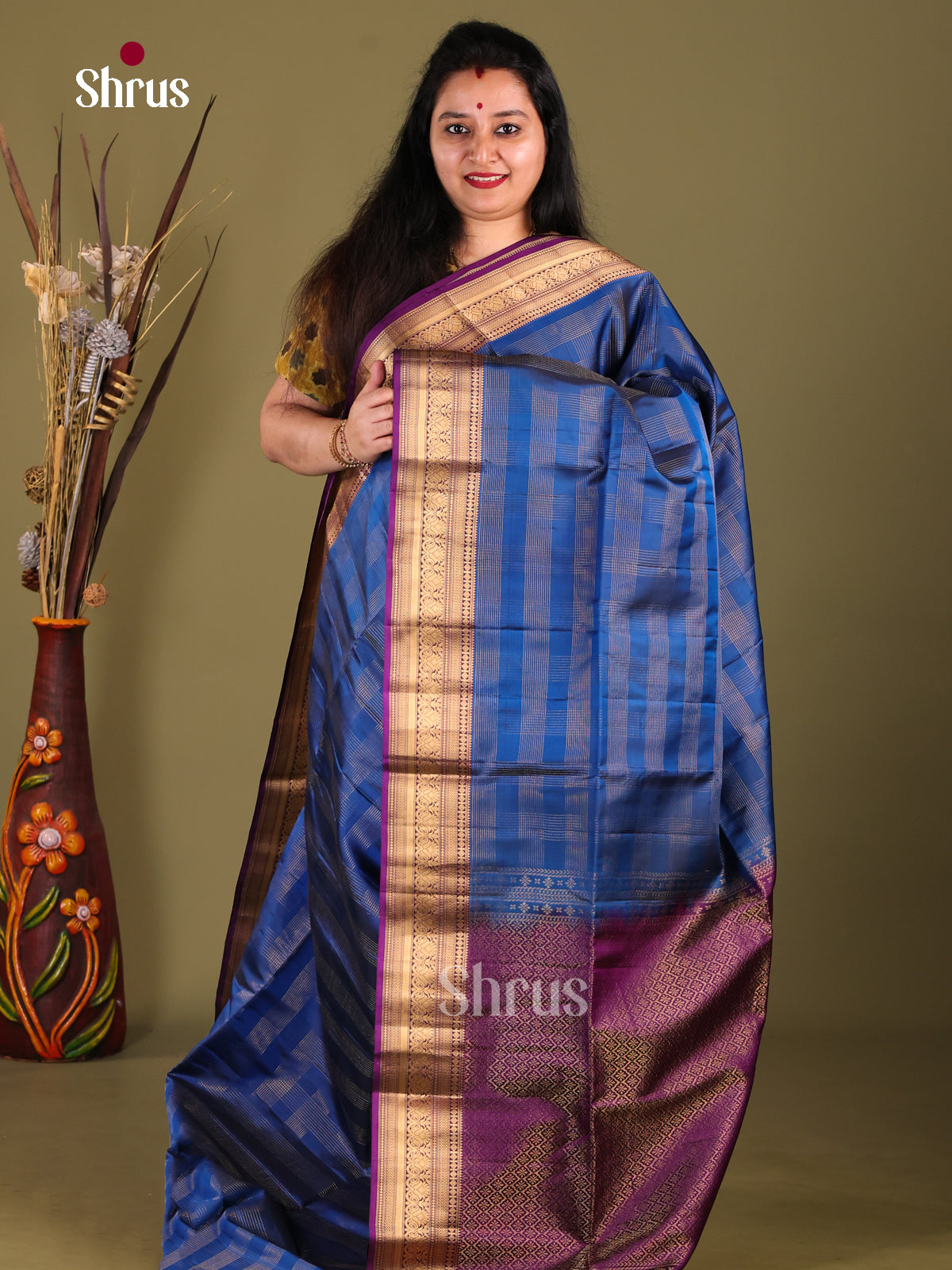 Ornate Blue Soft Silk Saree with zari checks & Purple Zari Border