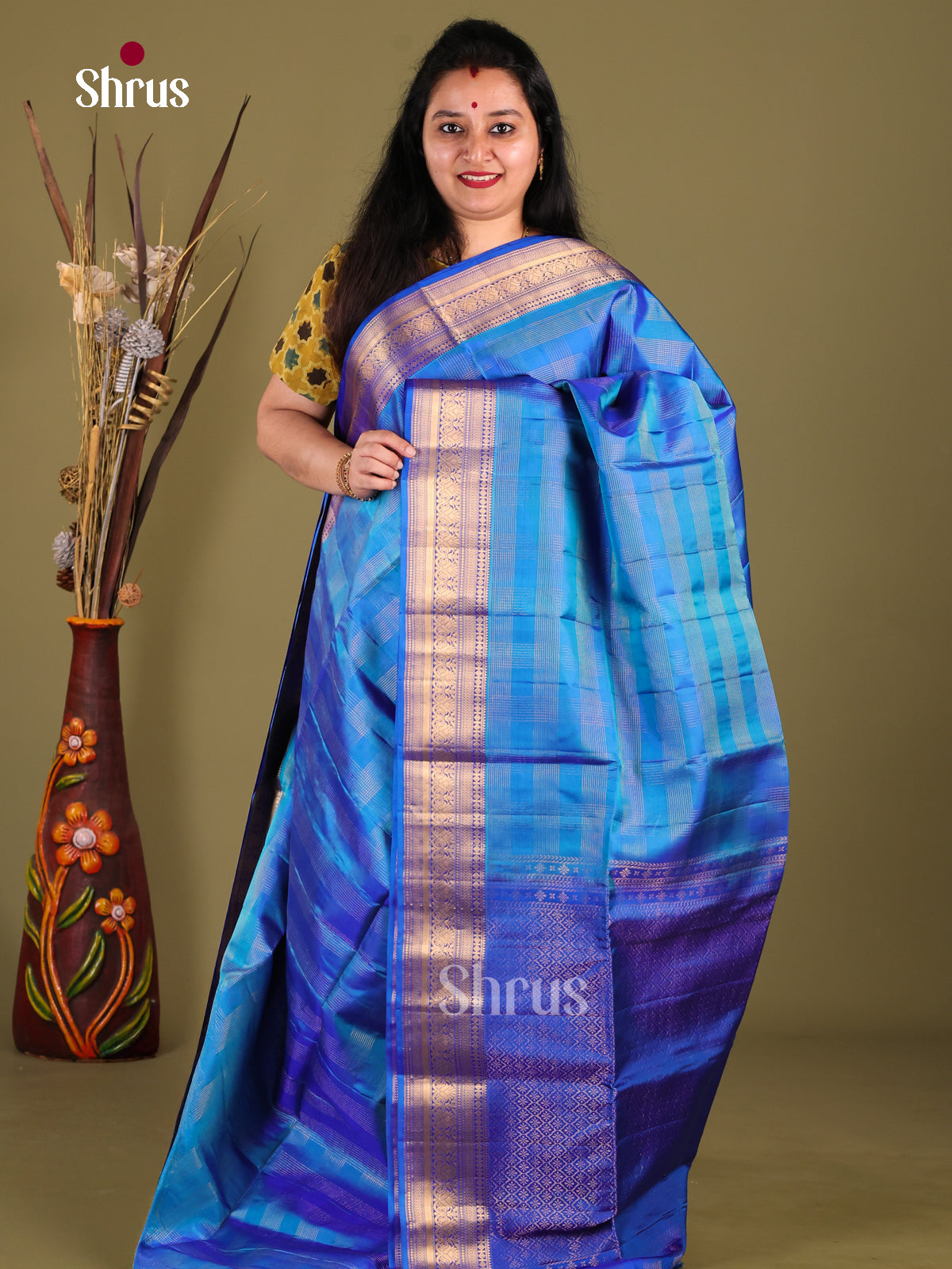 Vibrant Blue Soft Silk Saree with gold checks & rich Dark Blue zari border