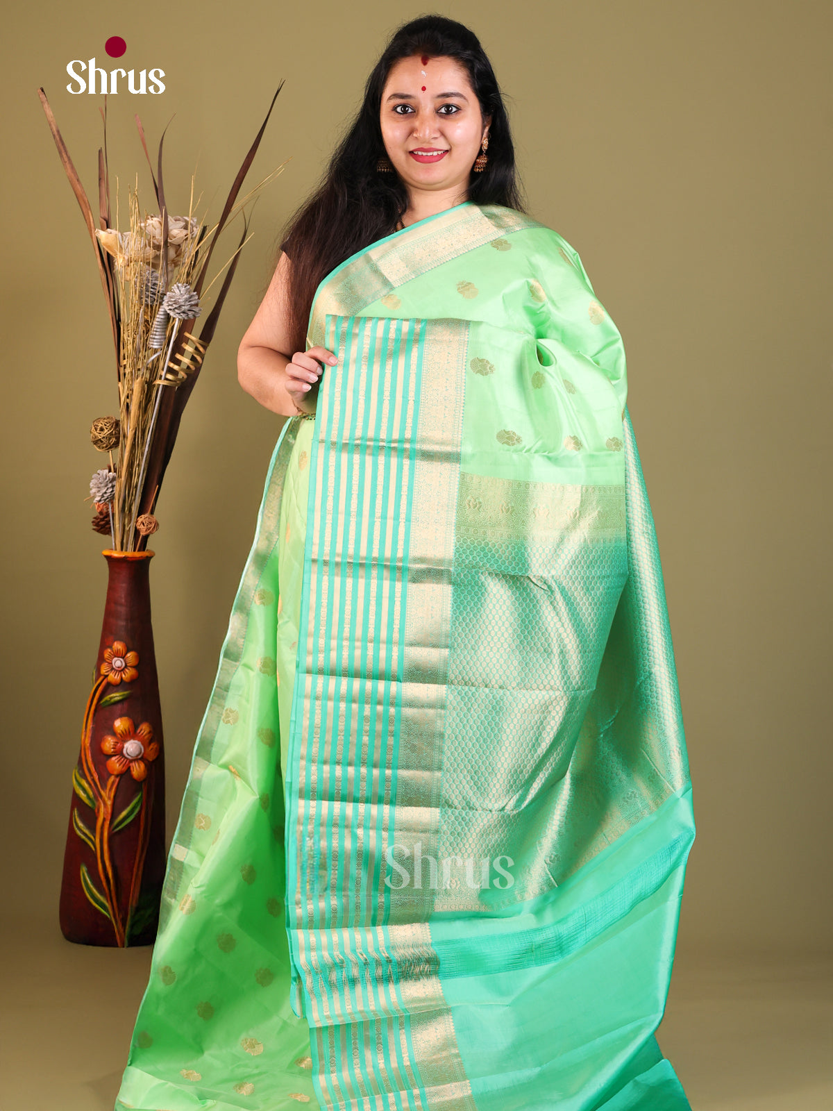 green lined Kanchipuram Butta design Saree