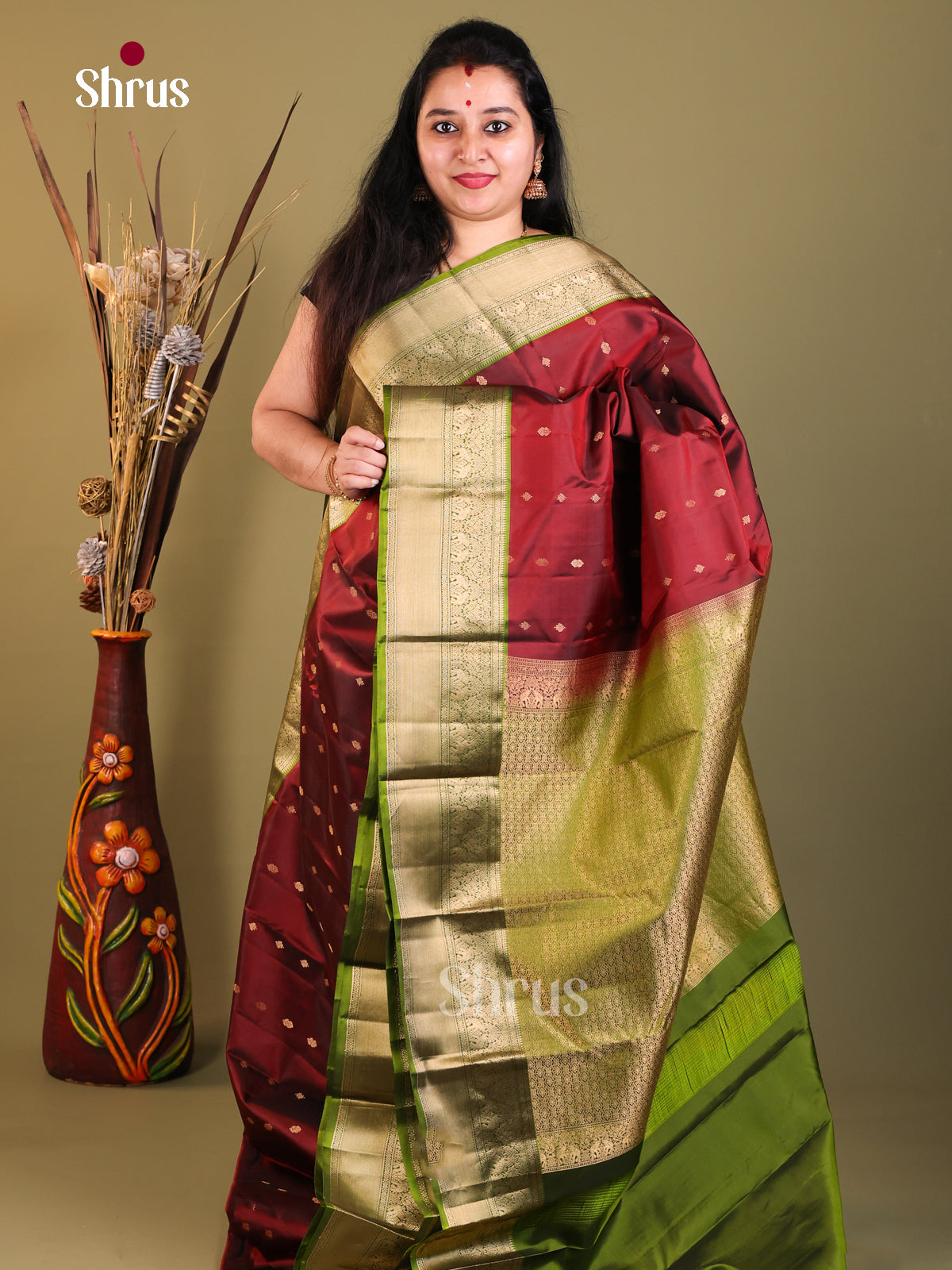 maroon and green Kanchipuram Butta design Saree