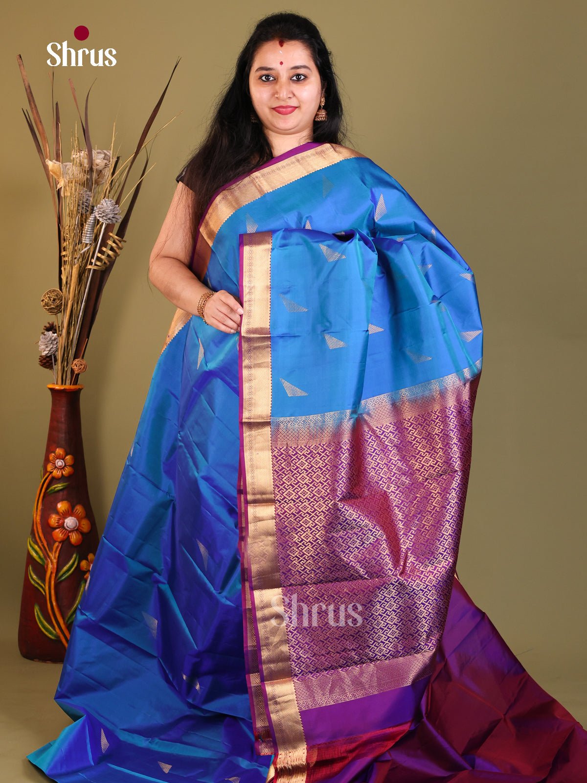 blue and shiny purple Kanchipuram Butta design Saree
