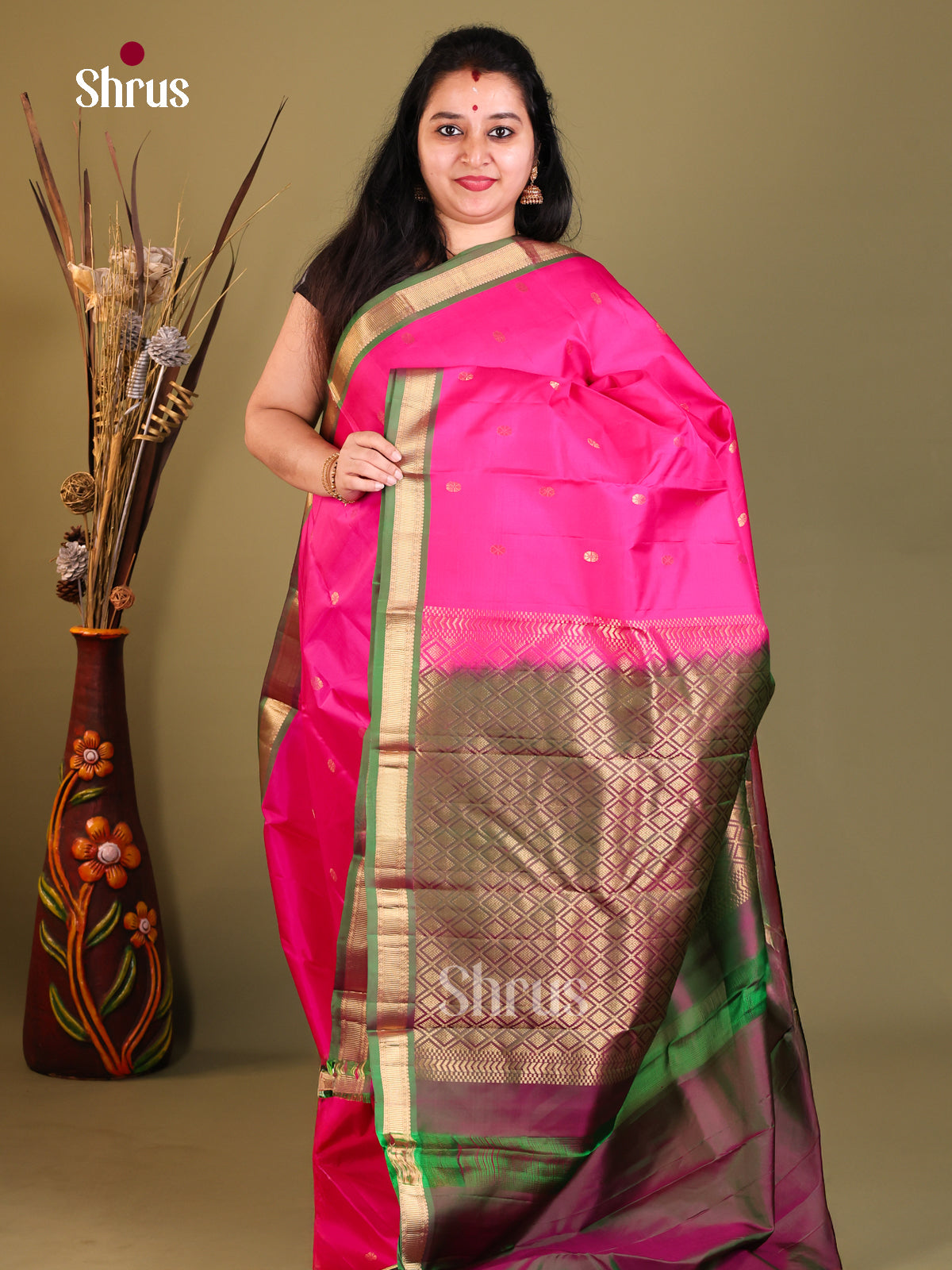Pink and green Kanchipuram Butta design Saree