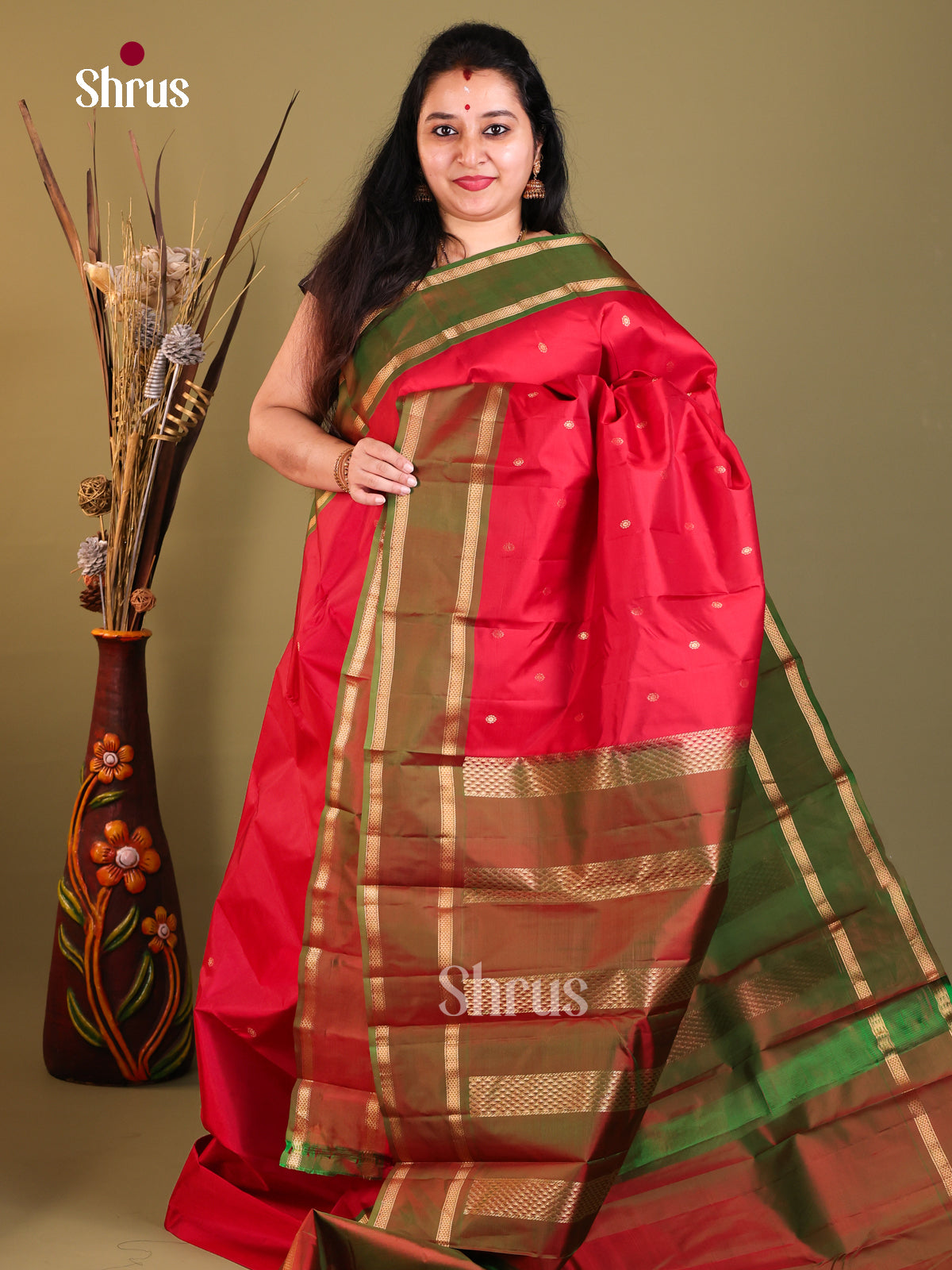 Red and green Kanchipuram Butta design Saree