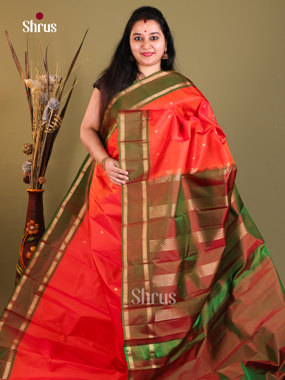 Orange and green Kanchipuram Butta design Saree