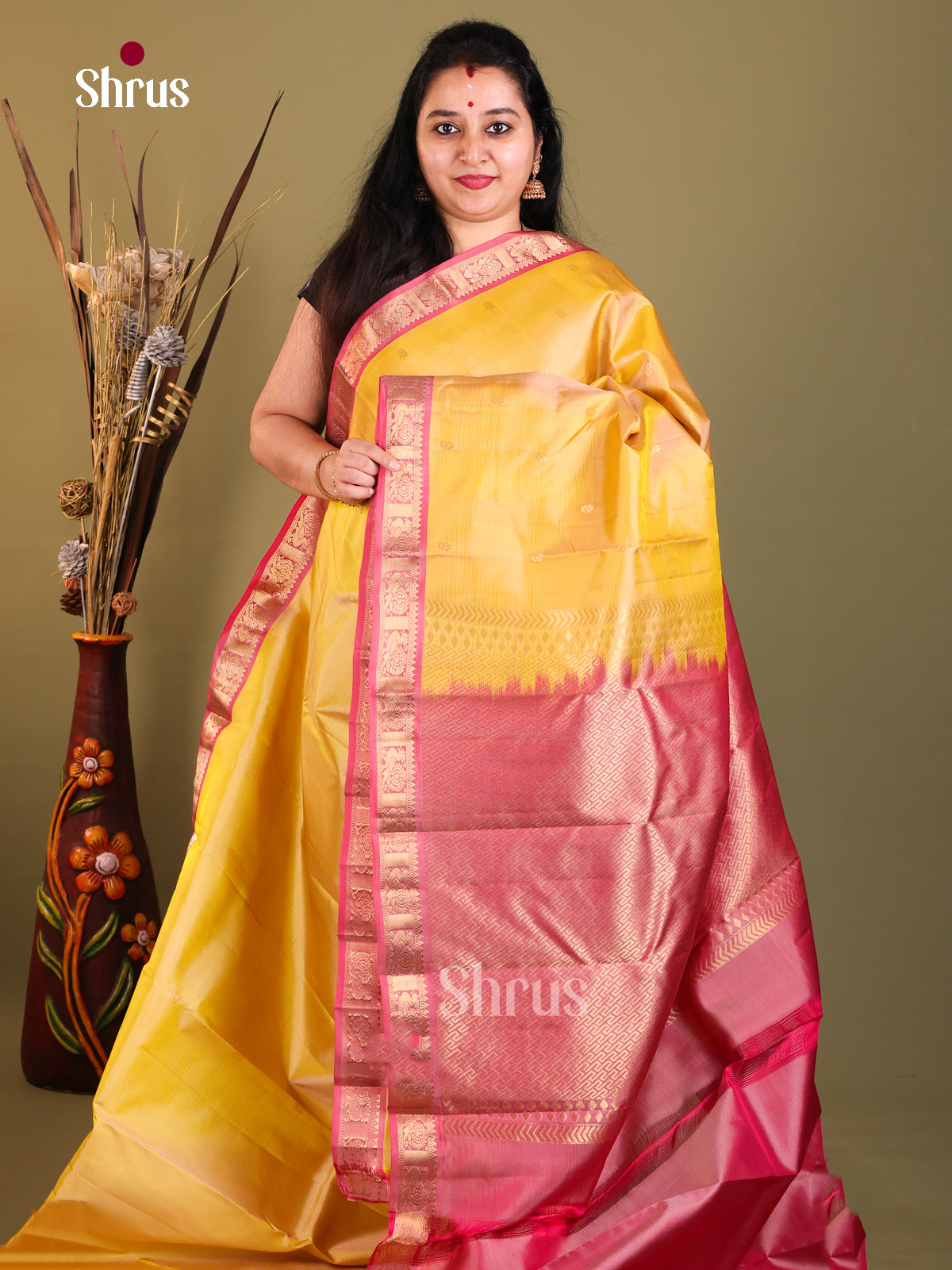 Yellow and pink Kanchipuram Butta design Saree