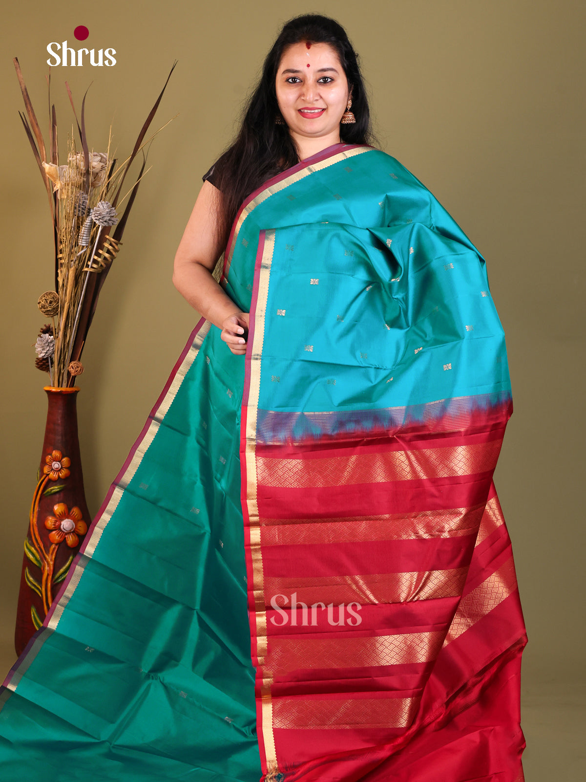 blue and red Kanchipuram Butta design Saree